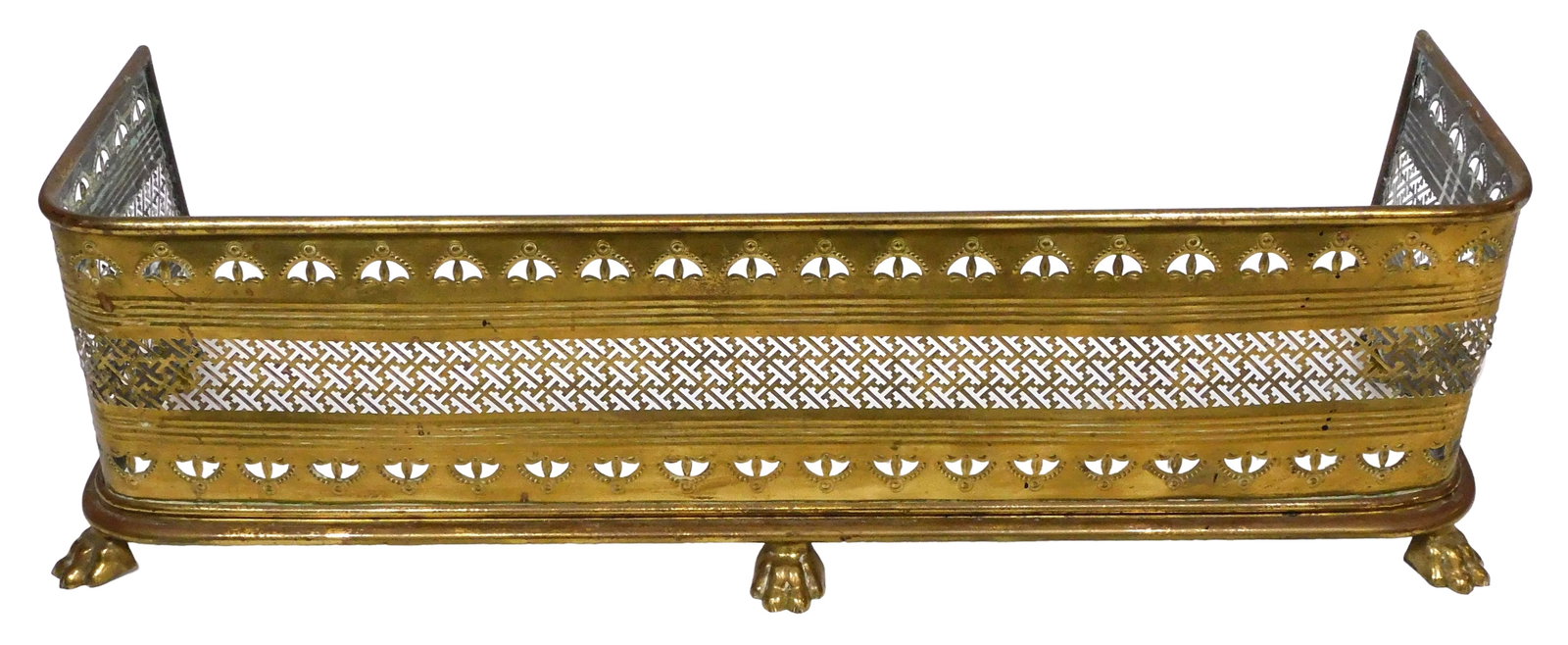Regency brass pierced fire fender, late 19th-early 20th C., likely English, pierced panel with: Regency brass pierced fire fender, late 19th-early 20th C., likely English, pierced panel with repeating geometrical and wheat flower motif, atop five paw feet, no maker's mark observed, wear consiste
