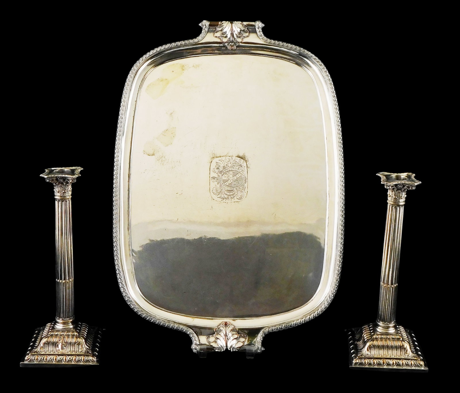 SILVER: Early Sheffield plate, three pieces, all silver on copper, including: pair of Corinthian: SILVER: Early Sheffield plate, three pieces, all silver on copper, including: pair of Corinthian columnar form candlesticks, square step-down bases, stamped '16' to side of base, 12" h.; and oblong tr