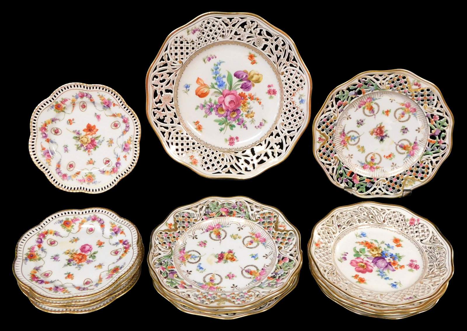 Schuman reticulated "Dresden" plates, fourteen pieces, 20th C., Germany, all pierced with floral (1 of 3)