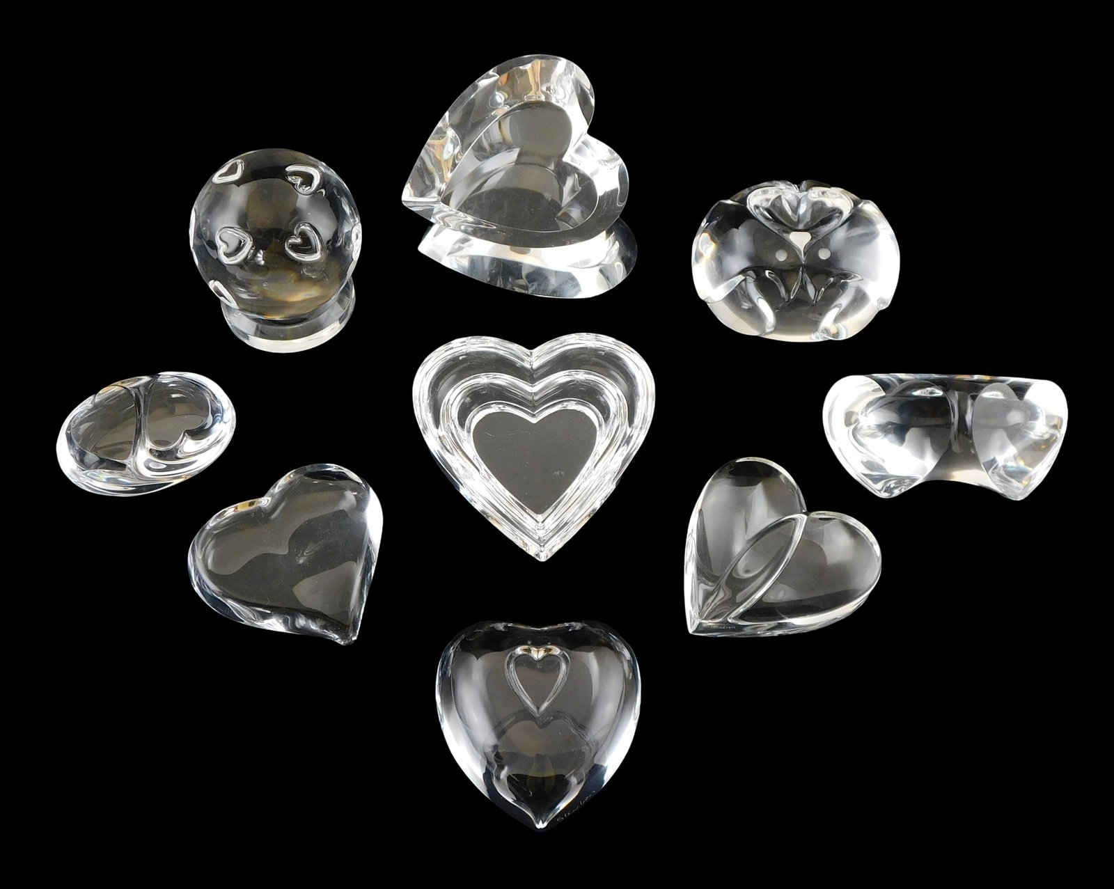 ART GLASS: Nine Steuben Heart themed crystal paperweights and hand coolers, all signed, including: (1 of 2)