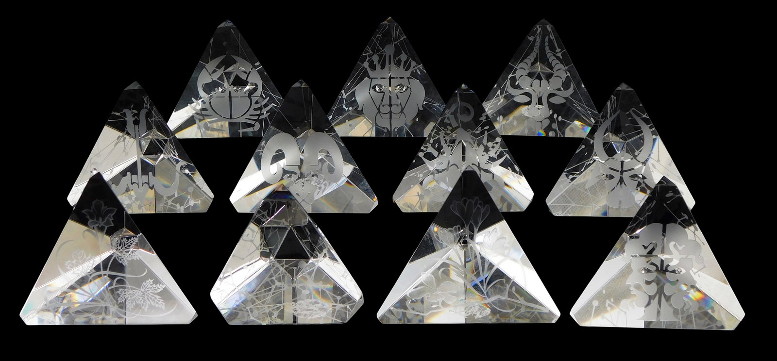 ART GLASS: Eleven Steuben crystal tetrahedron prisms, astrology and Tussie Mussie themed etchings, (1 of 2)