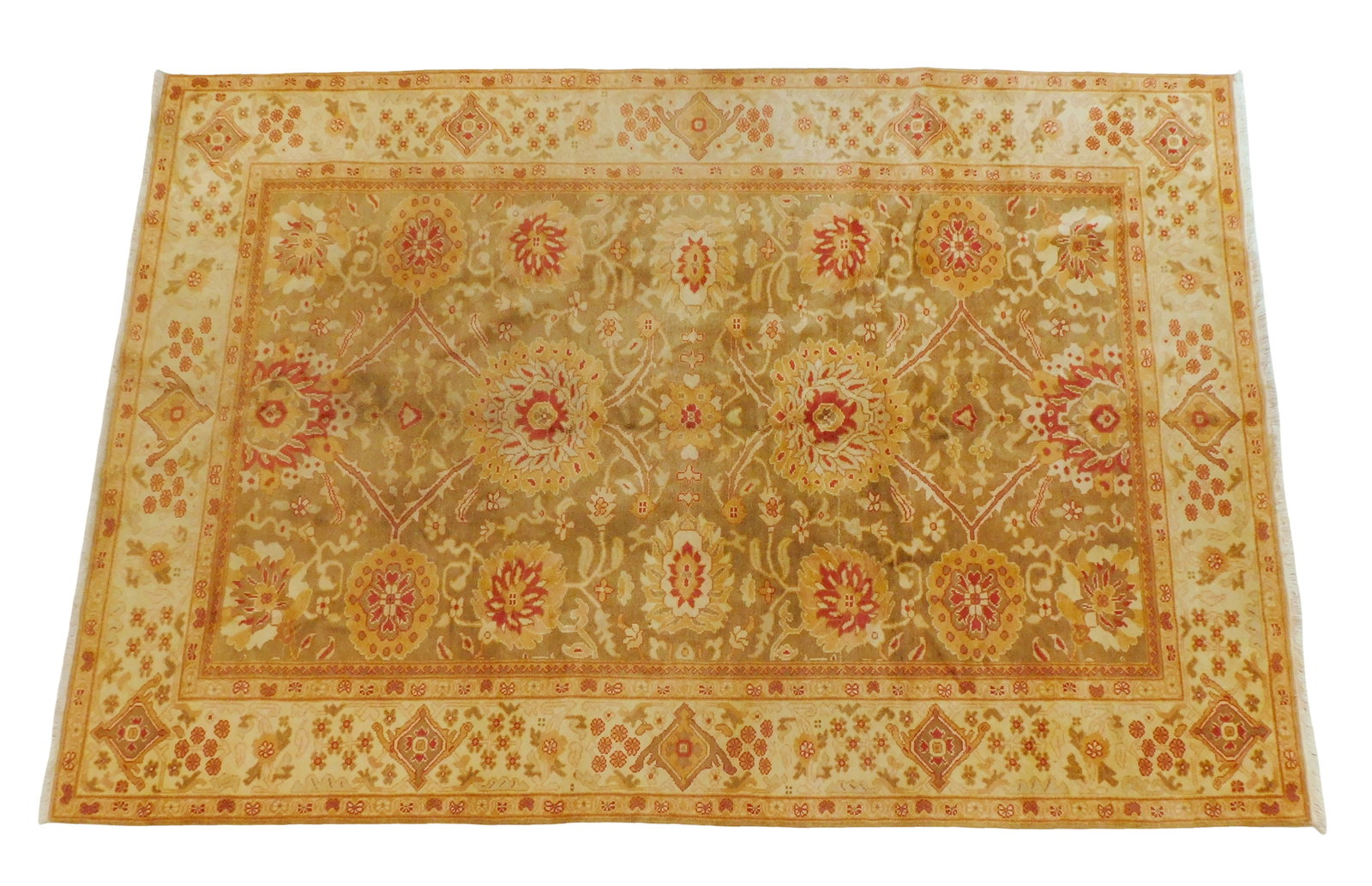 RUG: Peshawar Sultanabad, 6' 2" x 9' 1", wool on cotton, floral design with classic geometric motifs: RUG: Peshawar Sultanabad, 6' 2" x 9' 1", wool on cotton, floral design with classic geometric motifs on green ground, wear consistent with age and use.