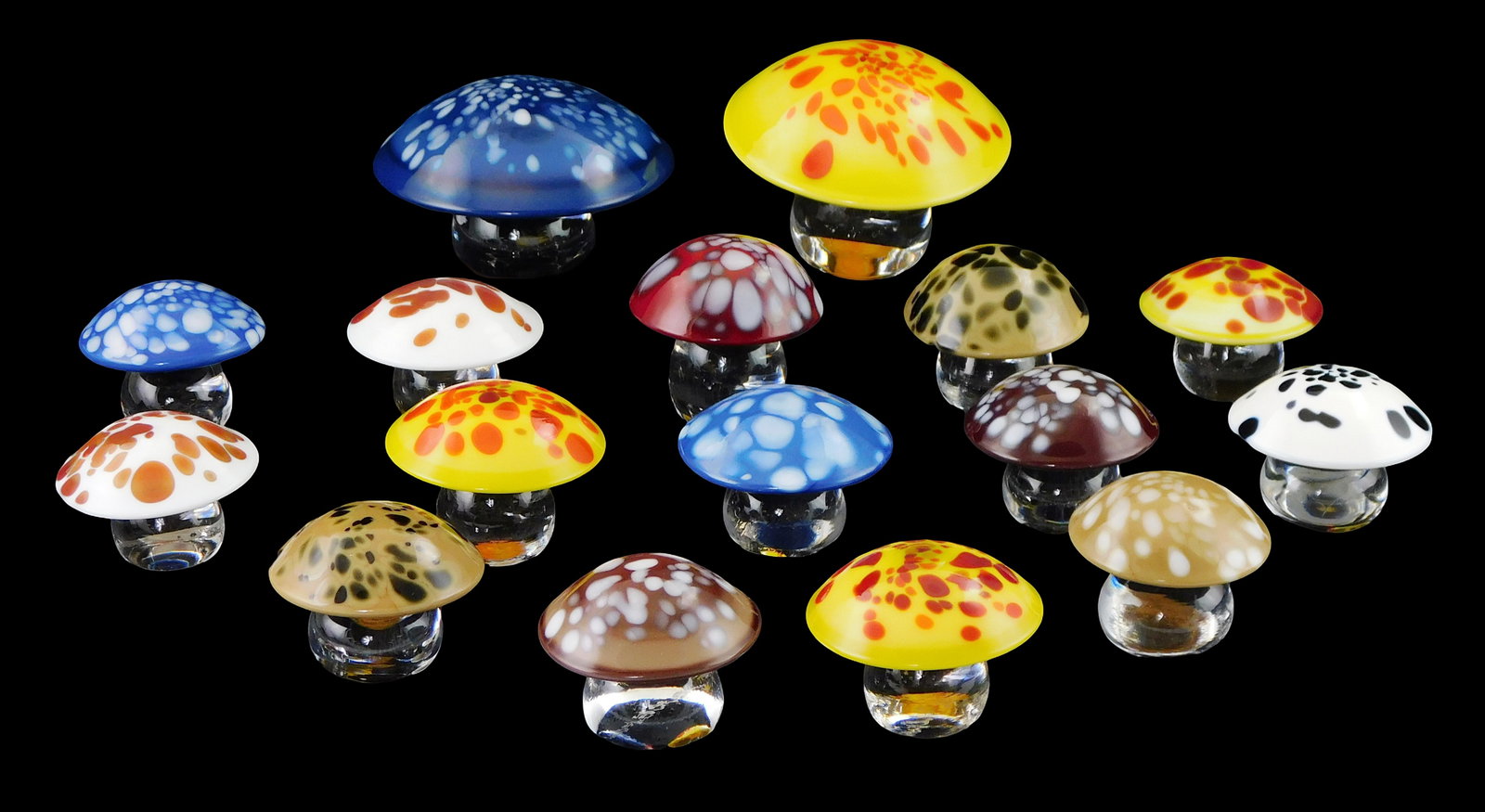 ART GLASS: Sixteen Orrefors glass mushroom paperweights, Sweden, 20th C., all with multicolored caps (1 of 2)