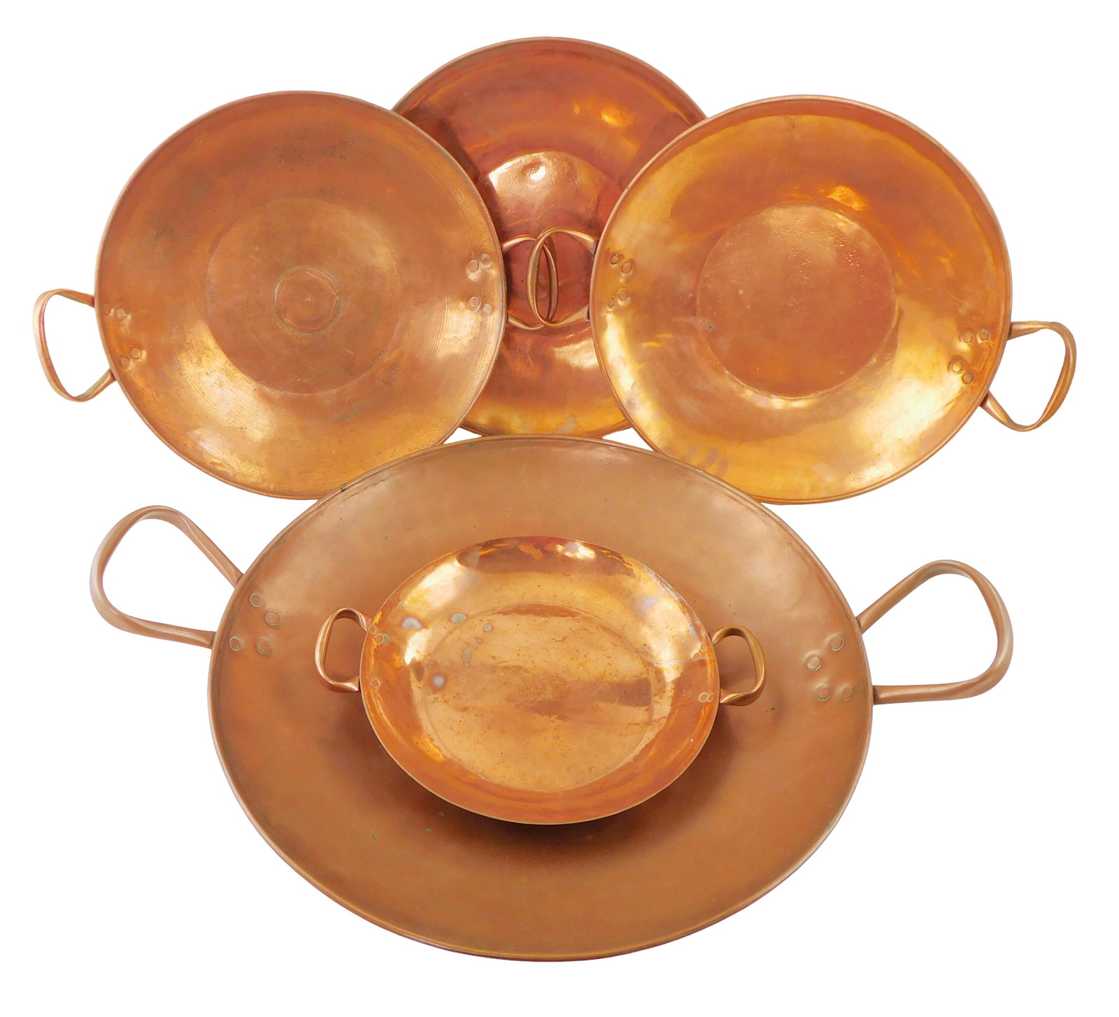 Copper double handle shallow pans, 20th C., five pieces, all with copper riveted handles, including: (1 of 2)