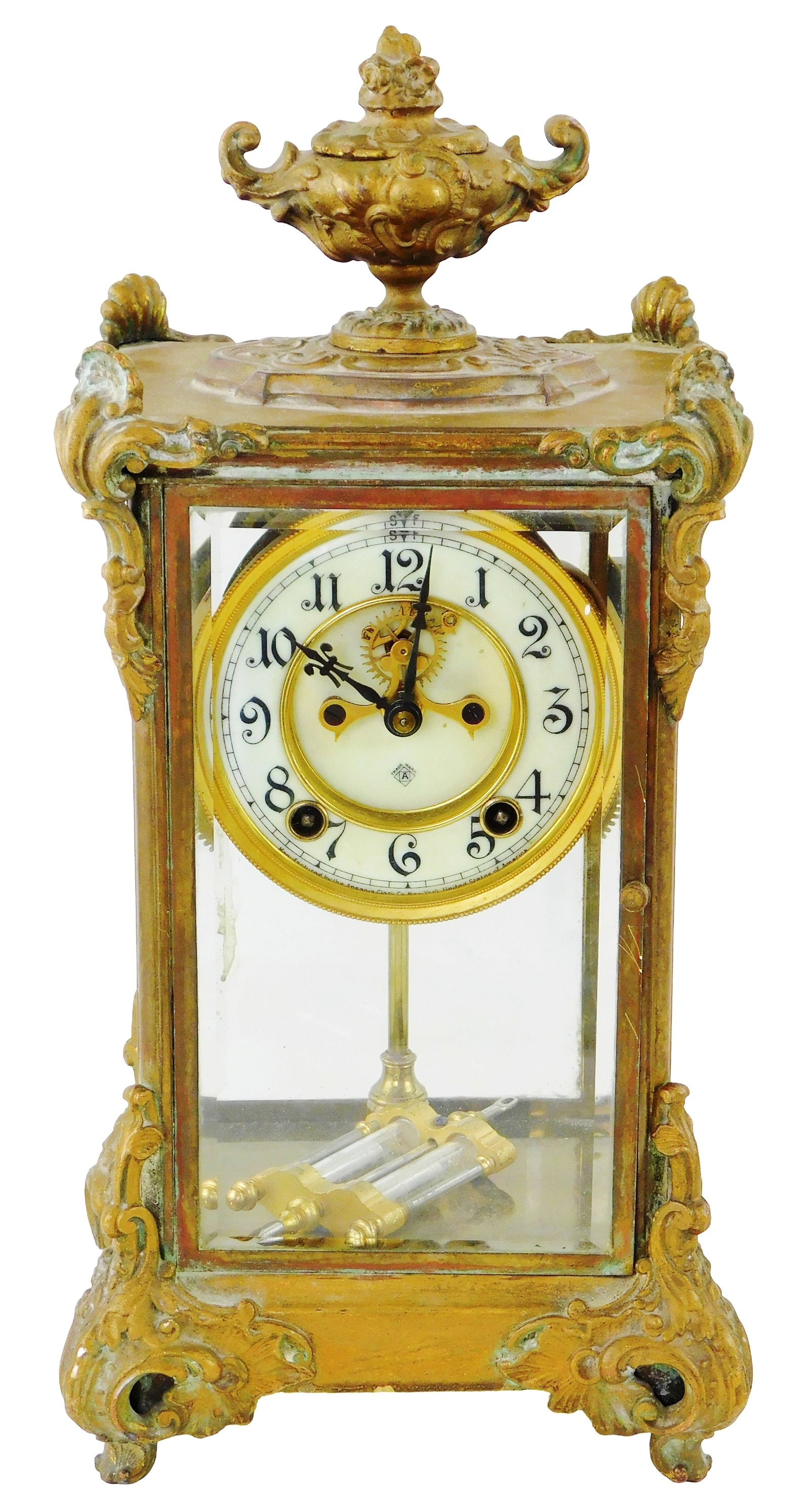 CLOCK: Ansonia 'Marquis' regulator mantel clock, first quarter 20th C., New York, ornate brass: CLOCK: Ansonia 'Marquis' regulator mantel clock, first quarter 20th C., New York, ornate brass casing with scrolling foliate motifs, raised on scrolled feet, urn finial to top, beveled crystal panes, 