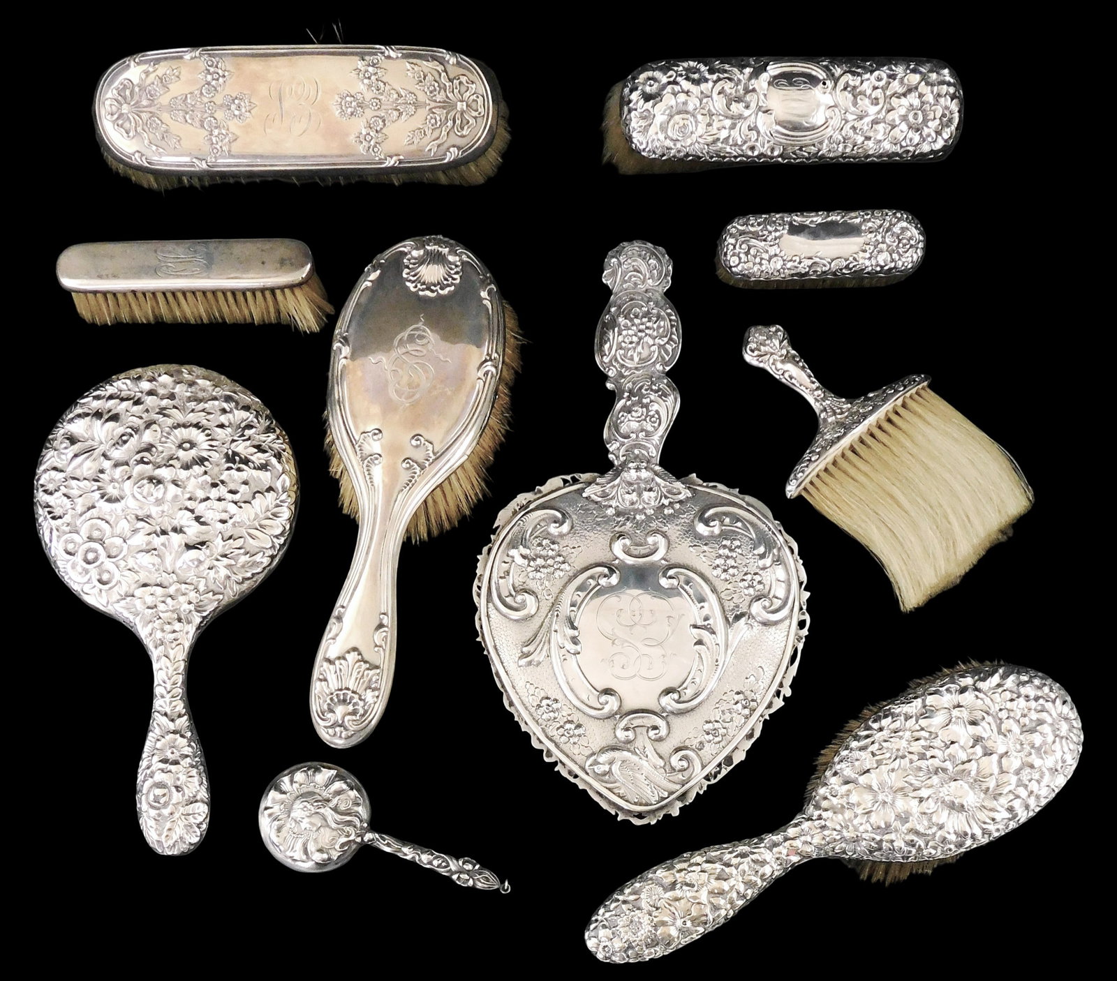 SILVER: Ten sterling silver grooming accessories, late 19th-early 20th C., each with repousse floral: SILVER: Ten sterling silver grooming accessories, late 19th-early 20th C., each with repousse floral and foliate decoration, all marked sterling, including: four pieces by Gorham, Rhode Island, large 