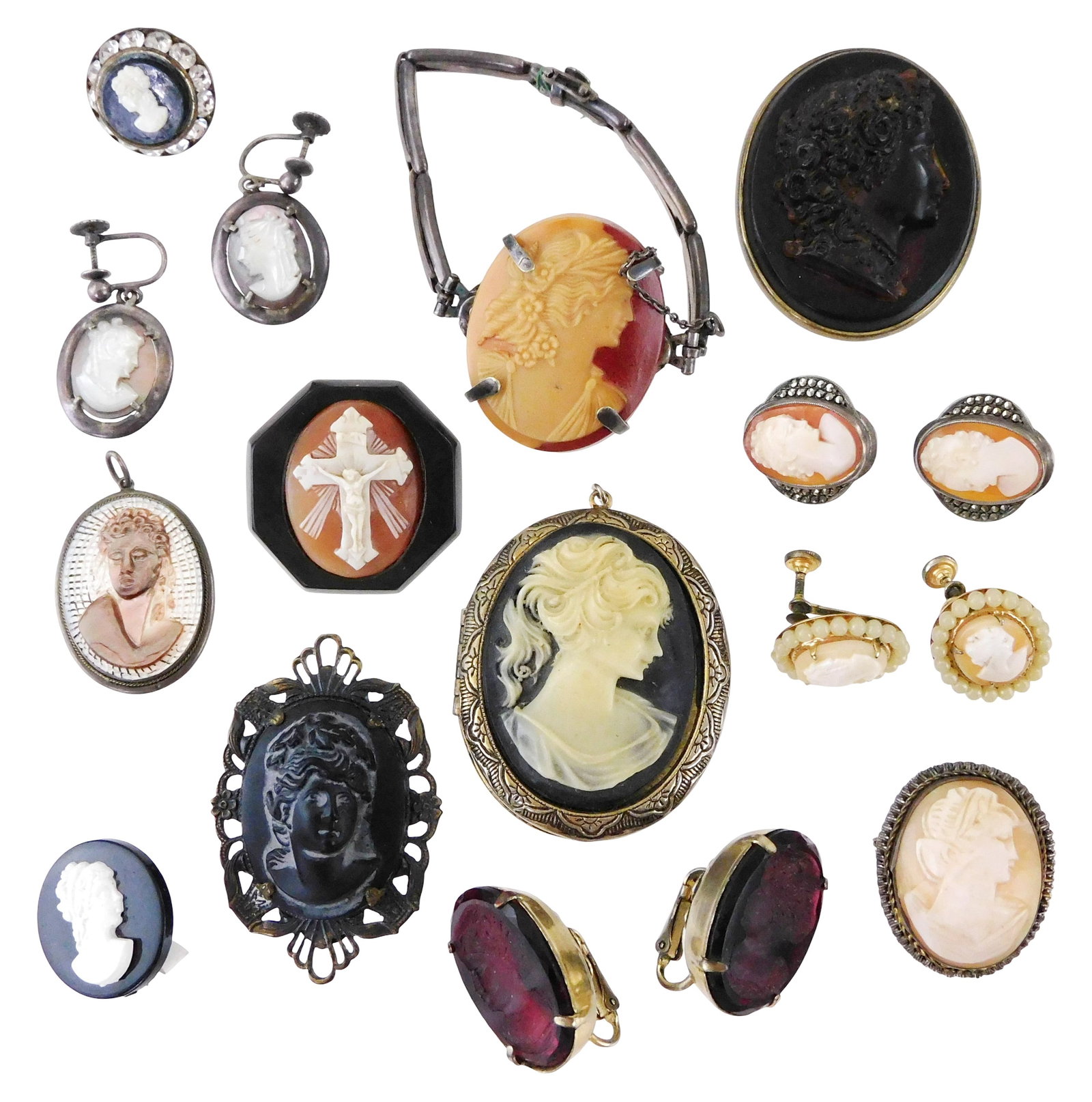 JEWELRY: Cameo and intaglio glass, seventeen pieces, 19th C. and later, details include: pair of red: JEWELRY: Cameo and intaglio glass, seventeen pieces, 19th C. and later, details include: pair of red intaglio glass clip earrings with incised portrait of a child; two Victorian faux tortoiseshell mou
