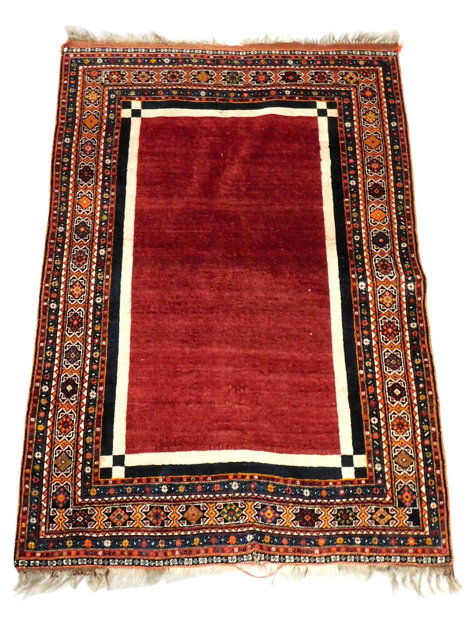 RUG: Modern Persian scatter rug, 5' 2" x 3' 7", wool on cotton, solid merlot field with bone and: RUG: Modern Persian scatter rug, 5' 2" x 3' 7", wool on cotton, solid merlot field with bone and navy borders, polychrome geometrical patterns and floral motif borders in blues, yellows, reds, oranges