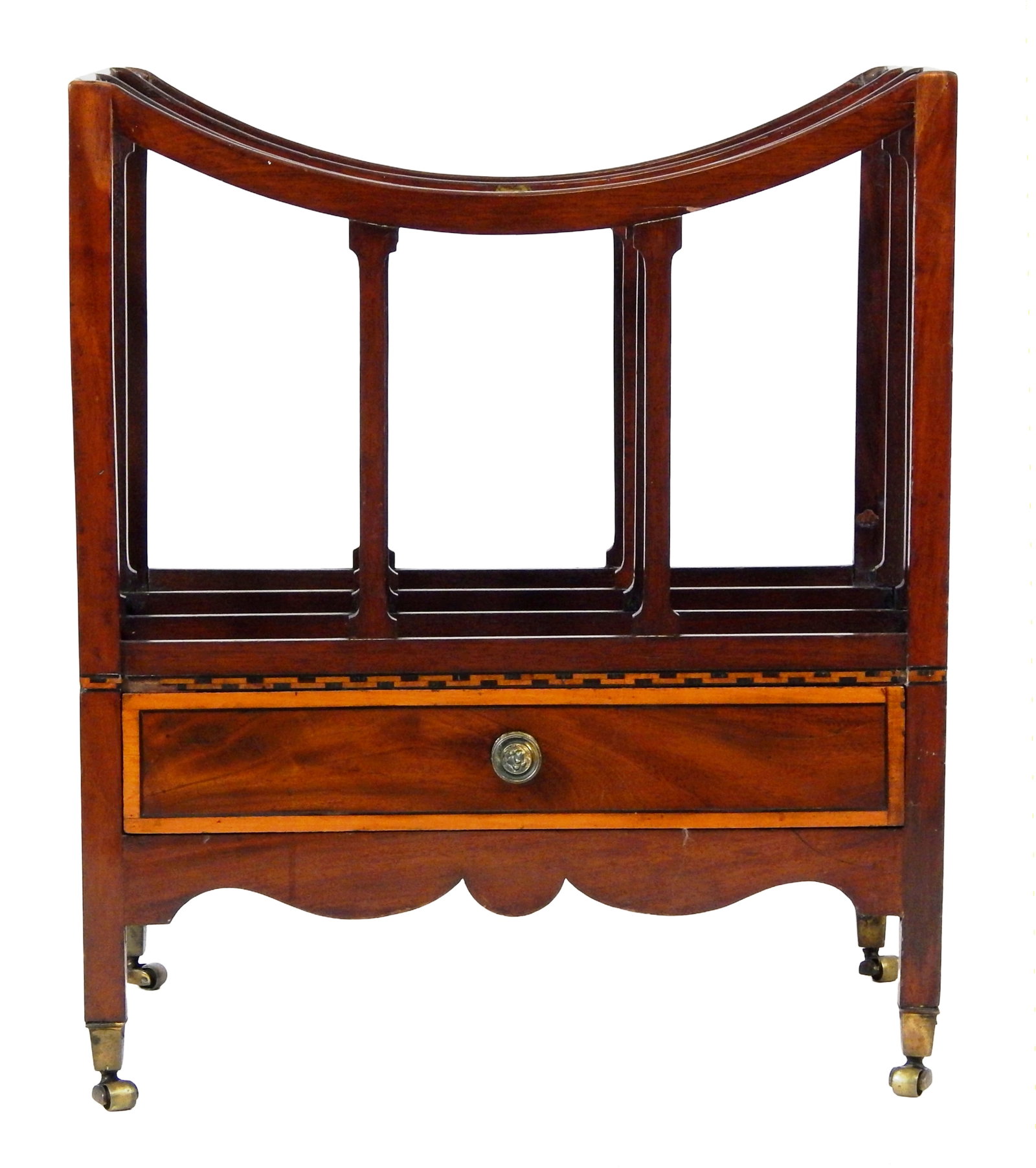 Regency canterbury/magazine rack, 19th C., likely mahogany, open four slot rack over single drawer,: Regency canterbury/magazine rack, 19th C., likely mahogany, open four slot rack over single drawer, rack with simple bowed ribbing with support columns, drawer with inlaid veneer, decorative lion's he