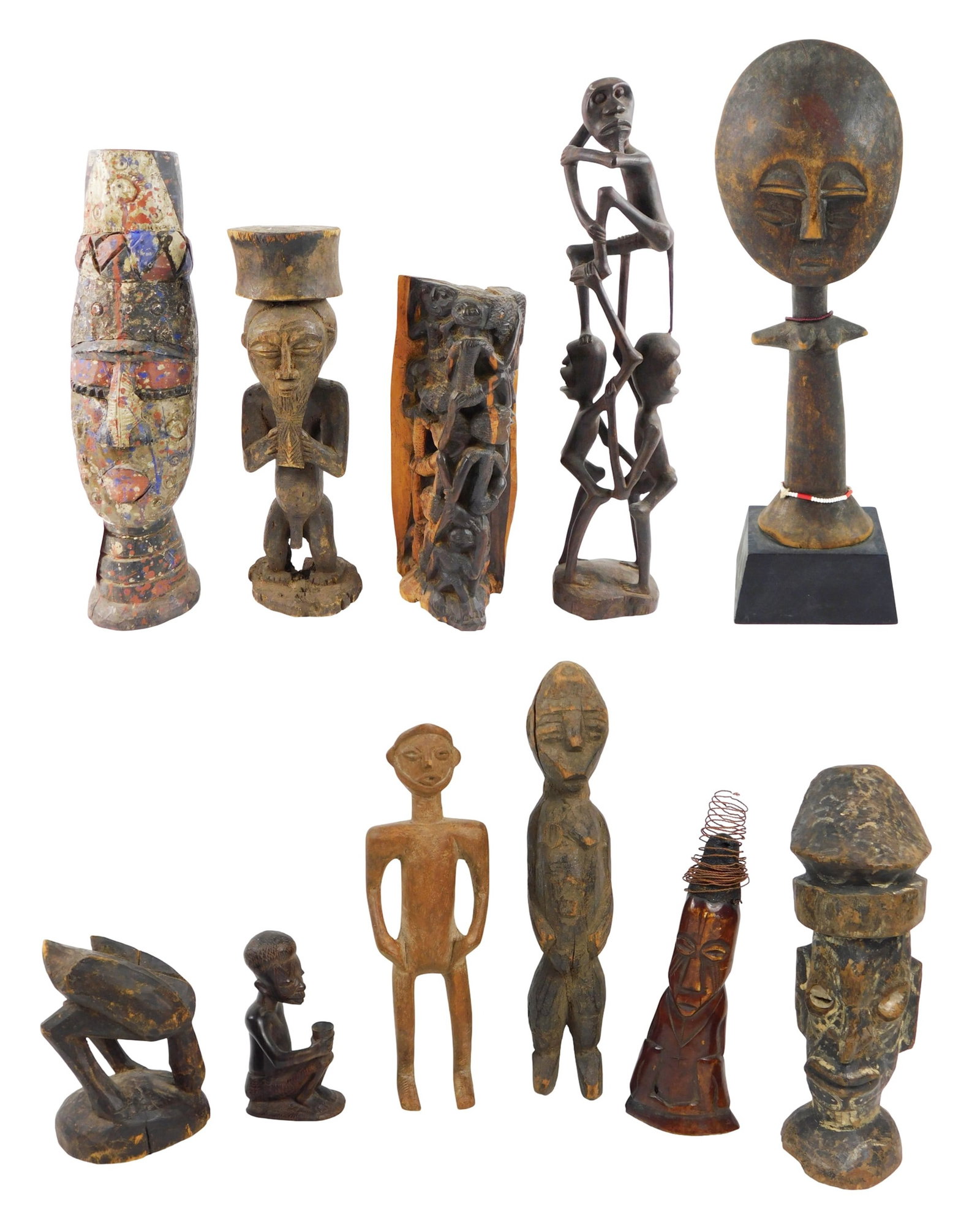 TRIBAL: Eleven African figural carvings, including: "Akuaba" type carved wood fertility figure, 20th (1 of 9)