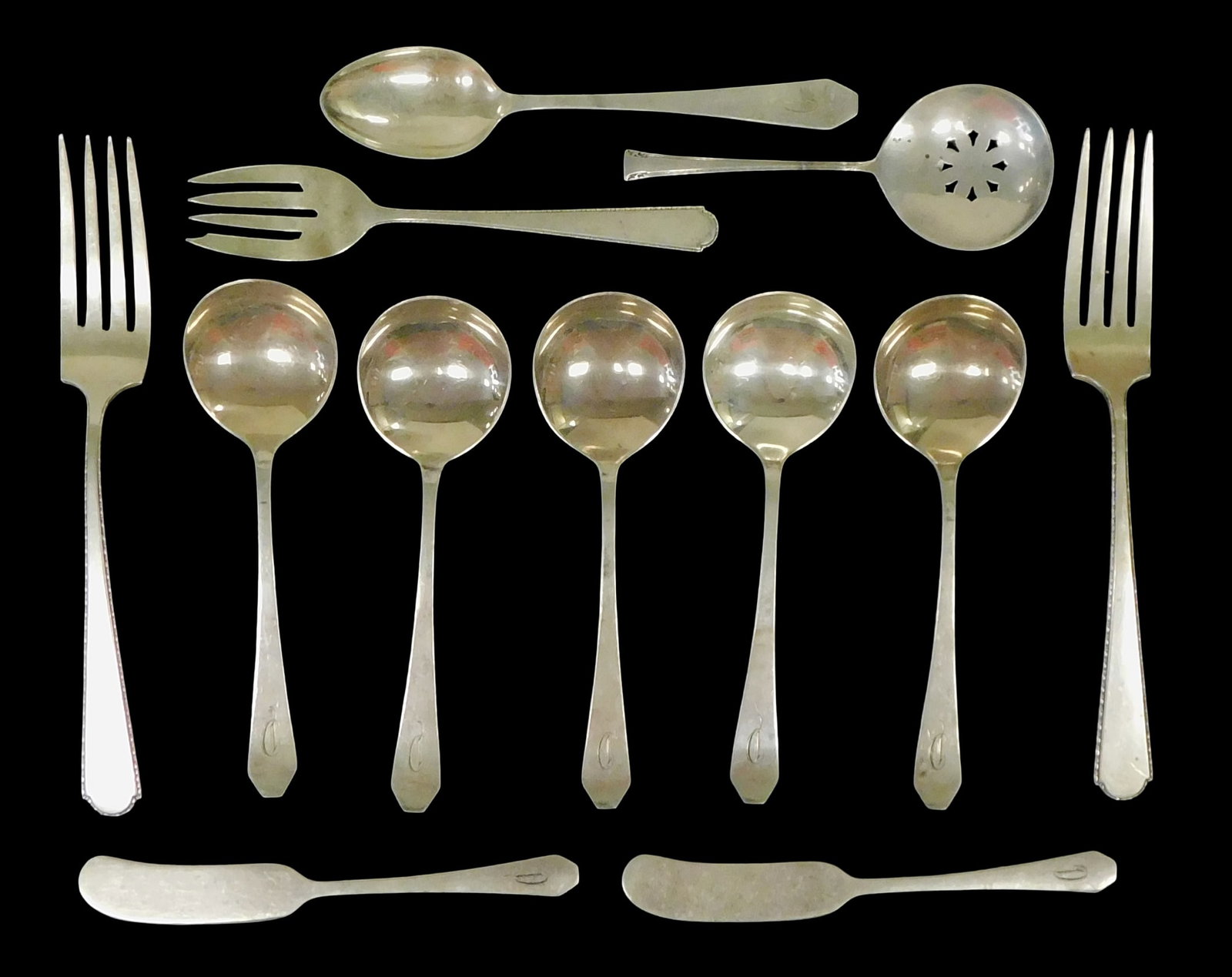STERLING: Frank W. Smith, International, Weidlich, etc., twelve pieces of sterling silver flatware,: STERLING: Frank W. Smith, International, Weidlich, etc., twelve pieces of sterling silver flatware, all stamped sterling on reverse, details include: five cream soup spoons, two solid individual butte