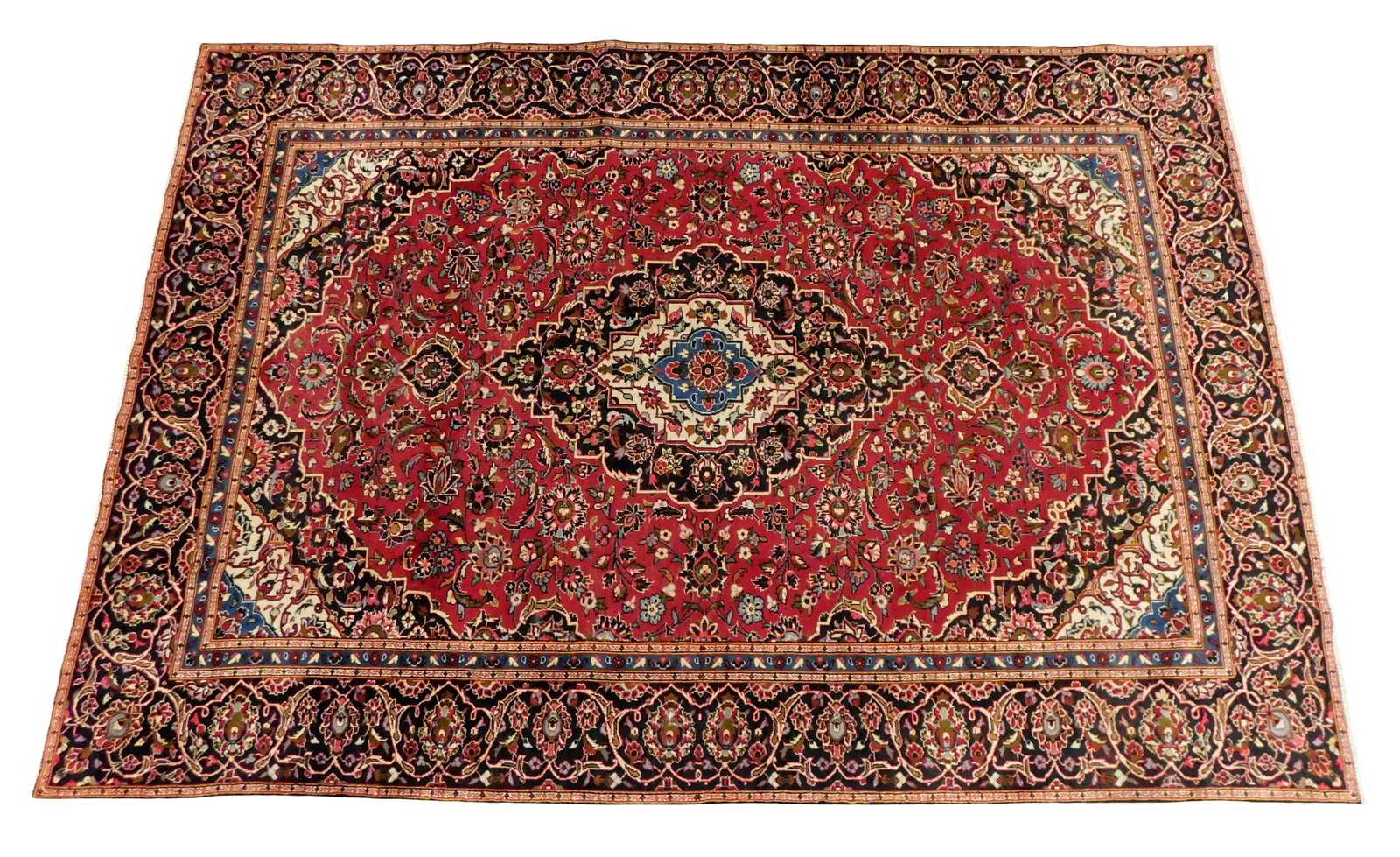 RUG: Kashan, 10' 11" x 7' 7", wool on cotton, central medallion, red field with black, cream and: RUG: Kashan, 10' 11" x 7' 7", wool on cotton, central medallion, red field with black, cream and blue accents, floral motifs throughout, wear consistent with age and use including some wear to ground,