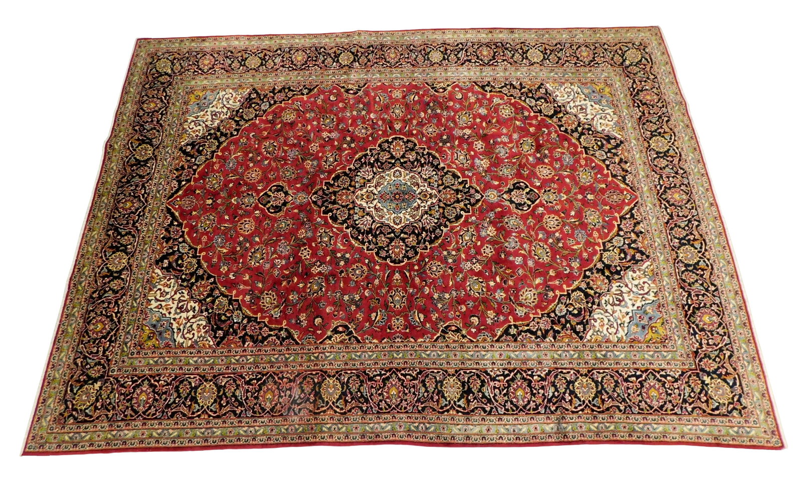 RUG: Kashan carpet, 10' x 13', 1940's - 1950's, wool on cotton, finely woven, red ground, central: RUG: Kashan carpet, 10' x 13', 1940's - 1950's, wool on cotton, finely woven, red ground, central medallion and spandrels, wear consistent with age and use. [HEAVY: PLEASE BRING APPROPRIATE ASSISTANCE