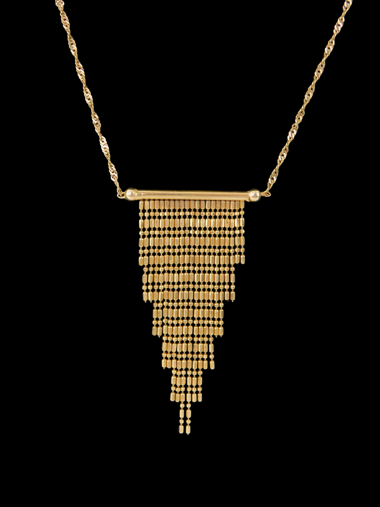JEWELRY: 14K Italian yellow gold waterfall necklace, stamped "AURAFIN" and "14K Italy" on link and: JEWELRY: 14K Italian yellow gold waterfall necklace, stamped "AURAFIN" and "14K Italy" on link and "585" on clasp, bar pendant with tapered fringe, spiral chain, wear consistent with age and use, 16 1