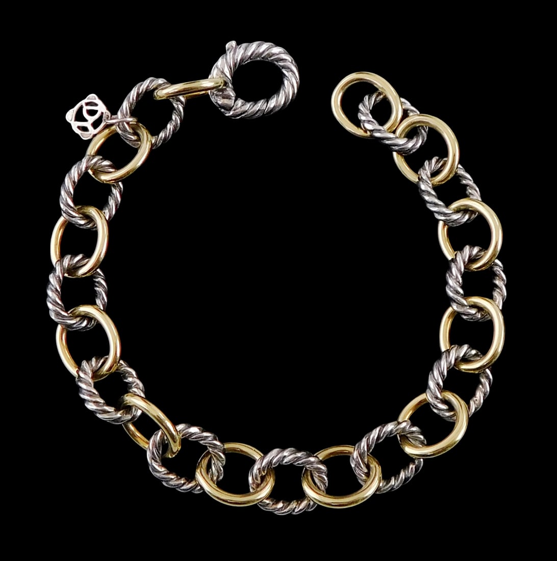 JEWELRY: David Yurman 18K and sterling silver oval link chain bracelet, design features alternating: JEWELRY: David Yurman 18K and sterling silver oval link chain bracelet, design features alternating sterling cable links and polished 18K links, hallmarked "750, 925" to interior of clasp, signed with