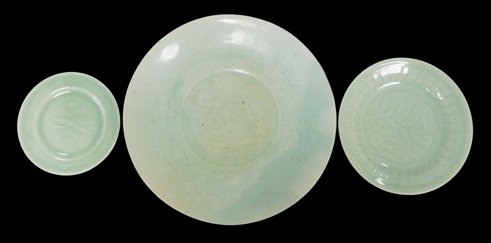 ASIAN: Three Chinese celadon glaze plates, details include: large 'Qingbai ware' incised charger, (1 of 9)