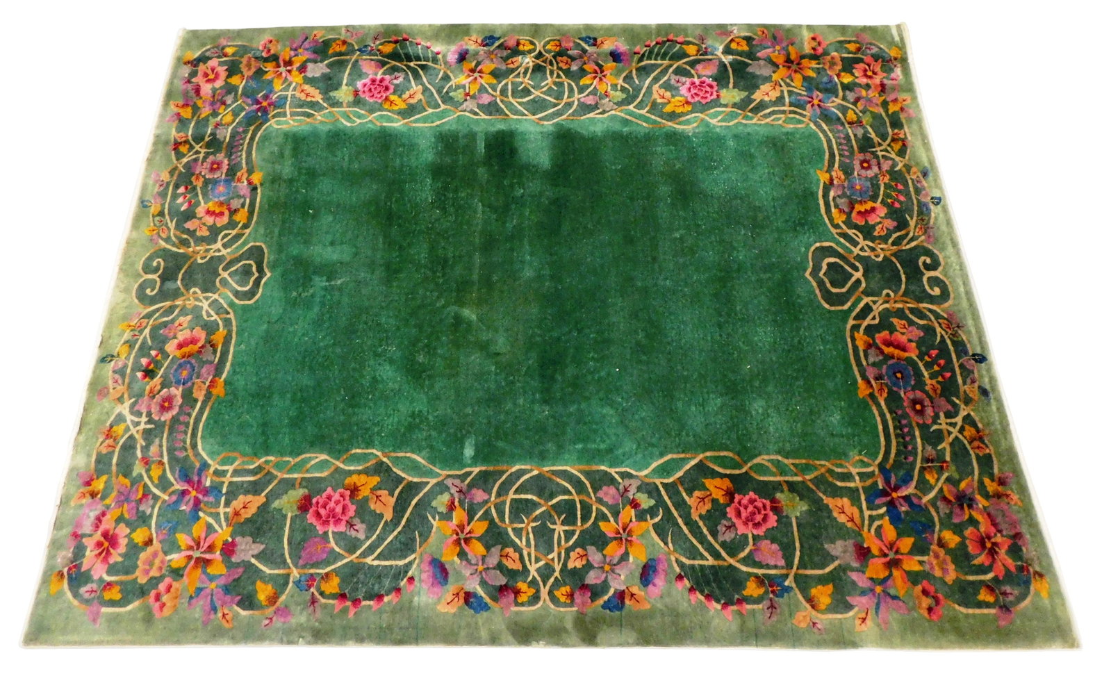 RUG: Chinese Deco carpet, 11' 7" x 8' 10", c. 1930's, wool on cotton, polychrome floral and foliate: RUG: Chinese Deco carpet, 11' 7" x 8' 10", c. 1930's, wool on cotton, polychrome floral and foliate scrolling vine border on green ground, wear consistent with age and use including old moth chews, st