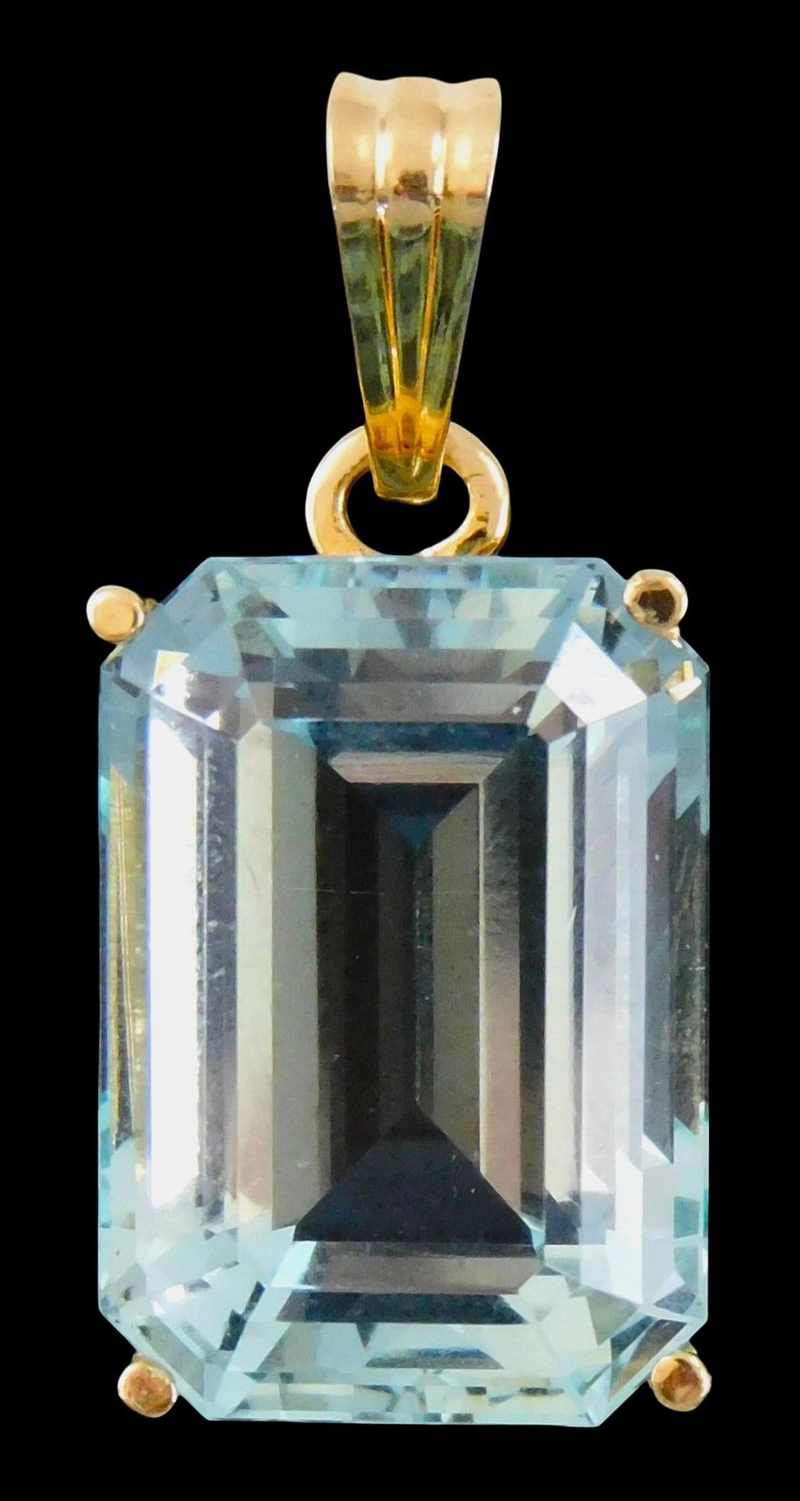 JEWELRY: 14K Aquamarine pendant, pendant setting with bail: stamped and tested "14K" yellow gold,: JEWELRY: 14K Aquamarine pendant, pendant setting with bail: stamped and tested "14K" yellow gold, four prong basket setting, set with one rectangular, emerald cut light blue natural aquamarine, 19.54 