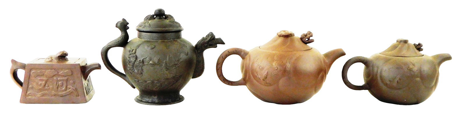 ASIAN: Four dragon motif Chinese Yixing teapots, 20th C., all brown with no glaze, all with stamped: ASIAN: Four dragon motif Chinese Yixing teapots, 20th C., all brown with no glaze, all with stamped bases, details include: small rectangular teapot, foo dog finial to lid, characters to sides; two ro