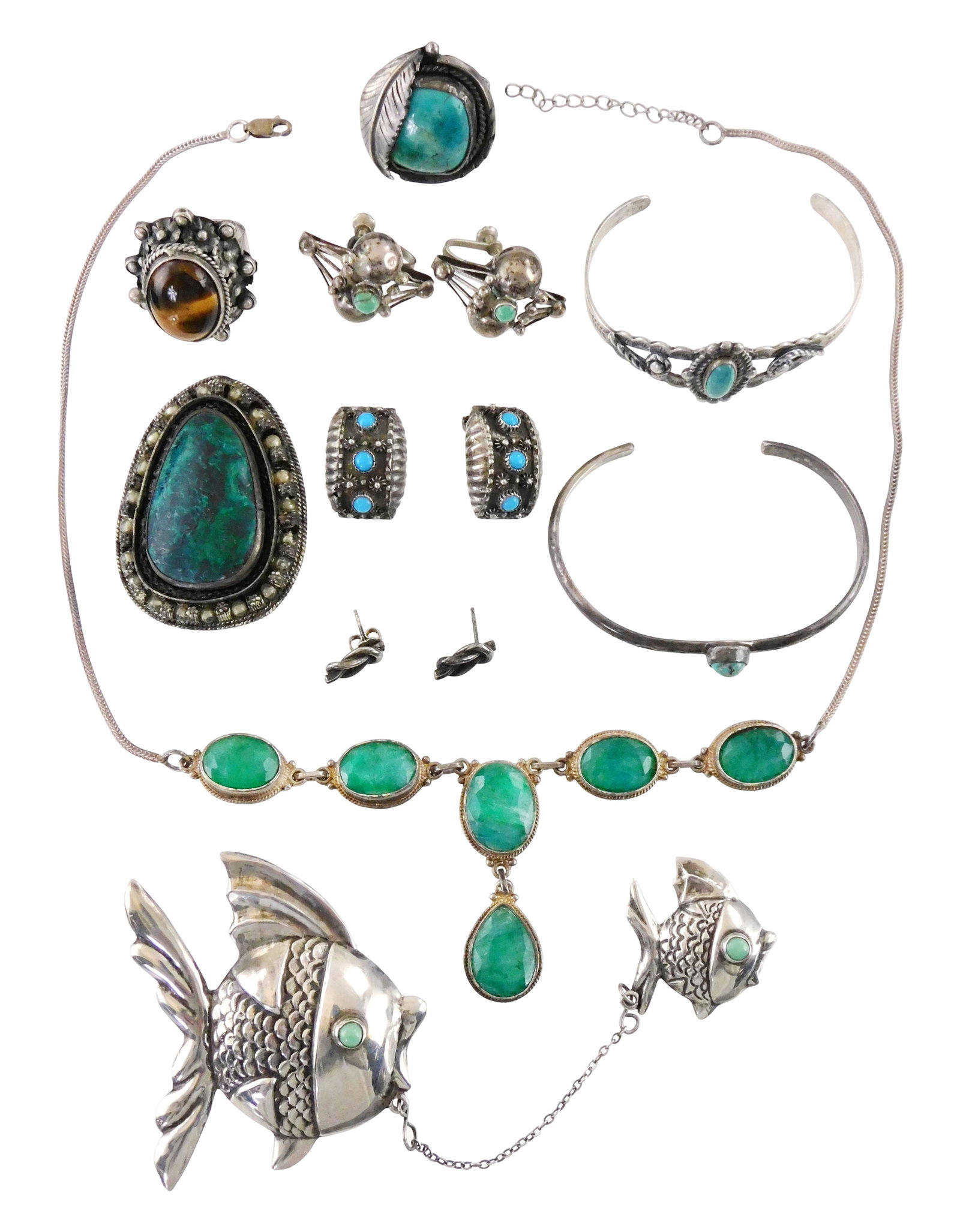 SILVER: Thirteen pieces of stamped sterling or tested silver, many Mexican/ Taxco or Southwest: SILVER: Thirteen pieces of stamped sterling or tested silver, many Mexican/ Taxco or Southwest style, most inlaid with stones resembling turquoise, items of interest include: double fish brooch stampe