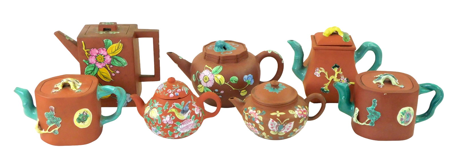 ASIAN: Chinese enamel painted floral and vine motif Yixing Teapots, seven pieces, 20th C., all: ASIAN: Chinese enamel painted floral and vine motif Yixing Teapots, seven pieces, 20th C., all unglazed, all with stamped bases, enamel painted scenes depicting flower buds, butterflies, birds and vin