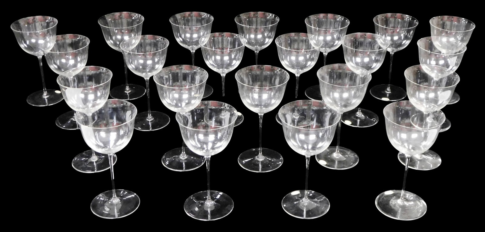 GLASS: Twenty-two Josef Hoffmann (Austrian, 1870 - 1952), Lobmeyr "Patrician" pattern wine glasses,: GLASS: Twenty-two Josef Hoffmann (Austrian, 1870 - 1952), Lobmeyr "Patrician" pattern wine glasses, many with applied maker's label to foot, featuring flared bowl and smooth stem, wear consistent with