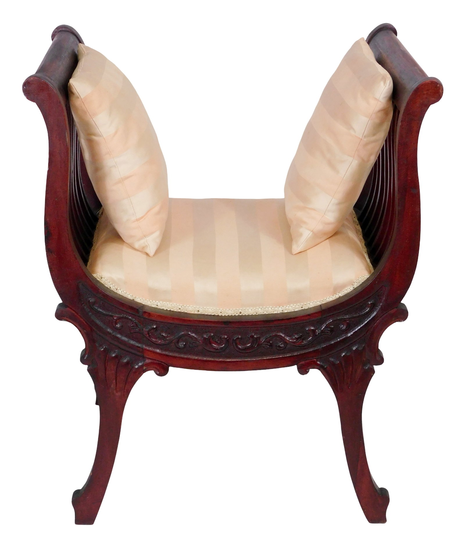 Window seat chair, late 19th-20th C, mahogany, pink striped upholstered seat with two pillows in: Window seat chair, late 19th-20th C, mahogany, pink striped upholstered seat with two pillows in dark hardwood "U" shaped frame, curved arms supported by conforming vertical slats, floral carved frame