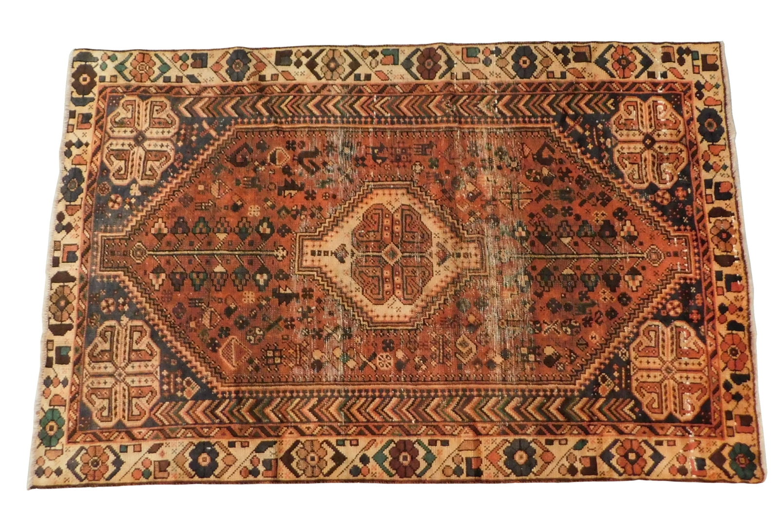 RUG: Gabehi rug, 5' 8" x 8' 8", wool on wool, red-orange ground, brown major border, cream minor: RUG: Gabehi rug, 5' 8" x 8' 8", wool on wool, red-orange ground, brown major border, cream minor borders, central medallion, floral motifs, repeating geometrical patterns, wear consistent with age and