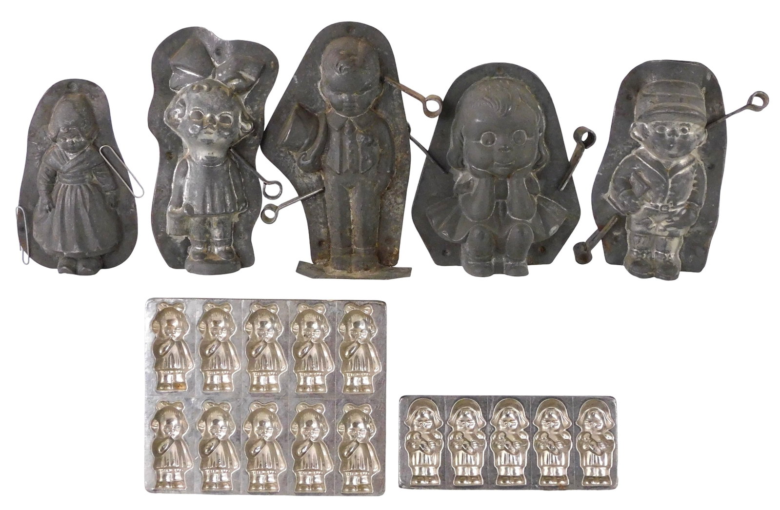 CHOCOLATE MOLDS: Seven Anton Reiche figural chocolate molds, 20th C., Dresden Germany, all with (1 of 4)