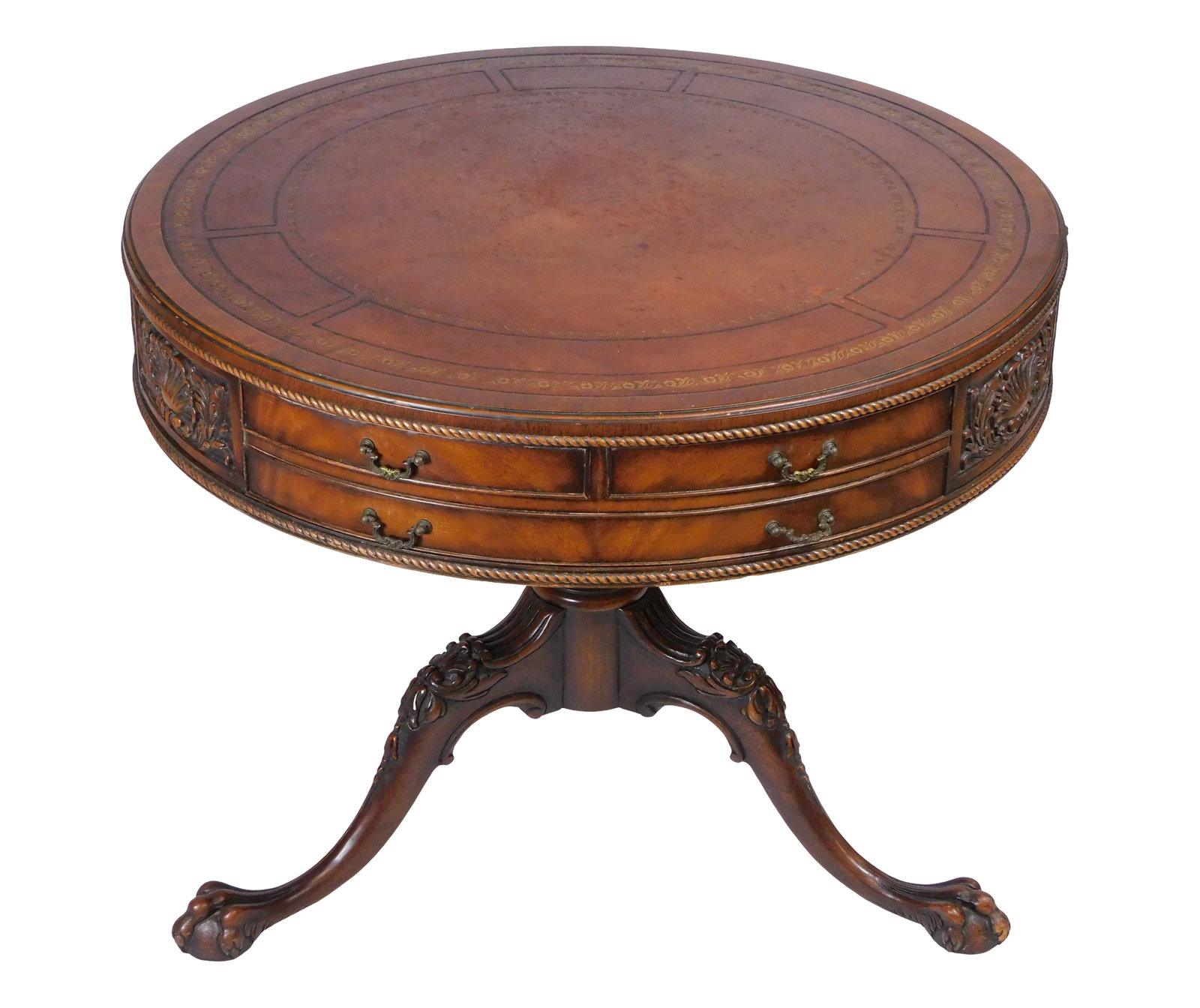 Drum table, English, 20th C., mahogany with oak second, in late 18th C. style, tooled leather top: Drum table, English, 20th C., mahogany with oak second, in late 18th C. style, tooled leather top over carved rope bead, apron with two-unit full depth drawer and sectioned shell and leafage carving a