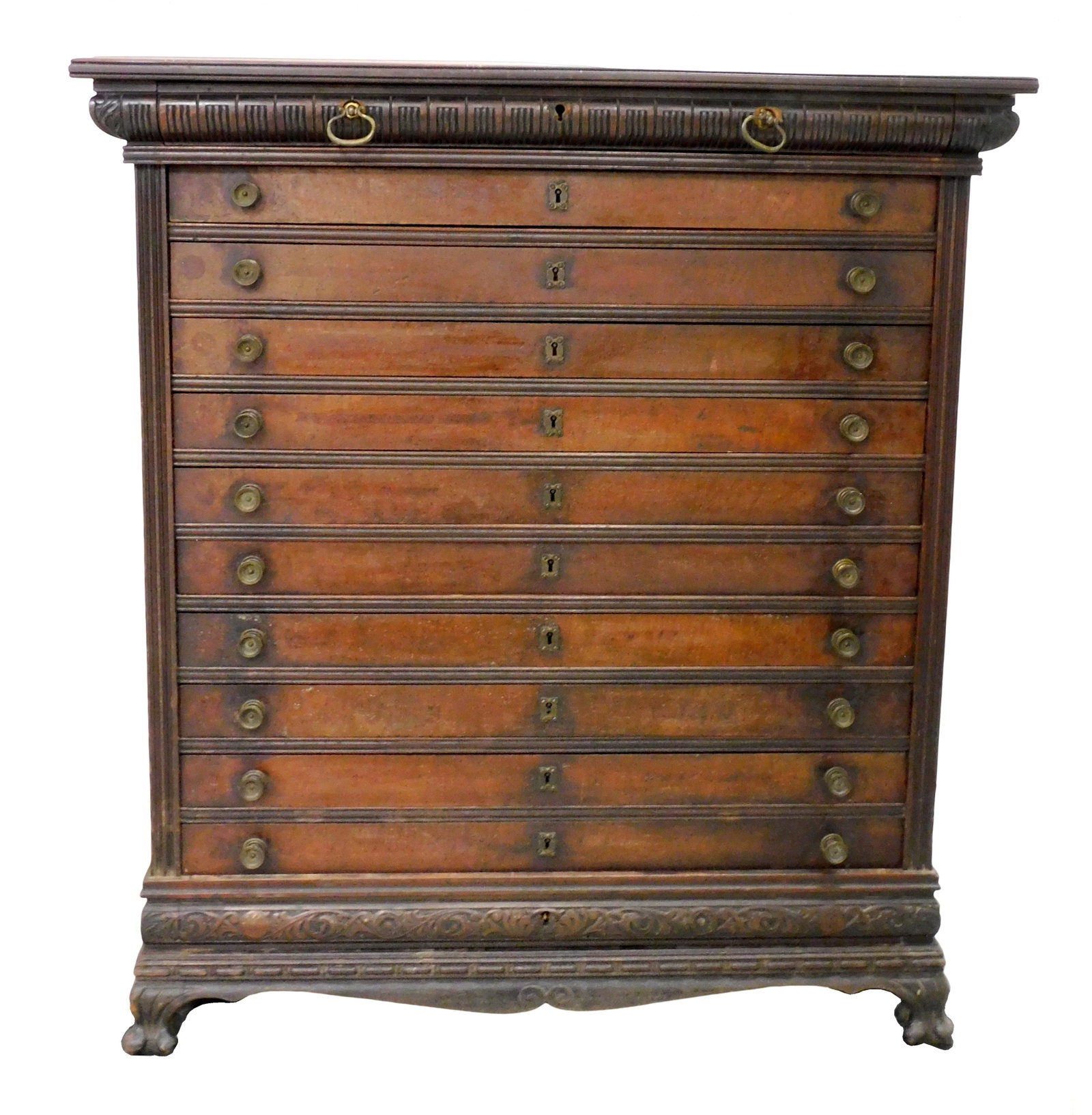Eastlake Victorian map or silver chest, c.1880s, walnut, cherry and poplar second, crotch veneer: Eastlake Victorian map or silver chest, c.1880s, walnut, cherry and poplar second, crotch veneer drawer fronts, twelve carved top and bottom drawers with sunburst carved side panels all on carved base
