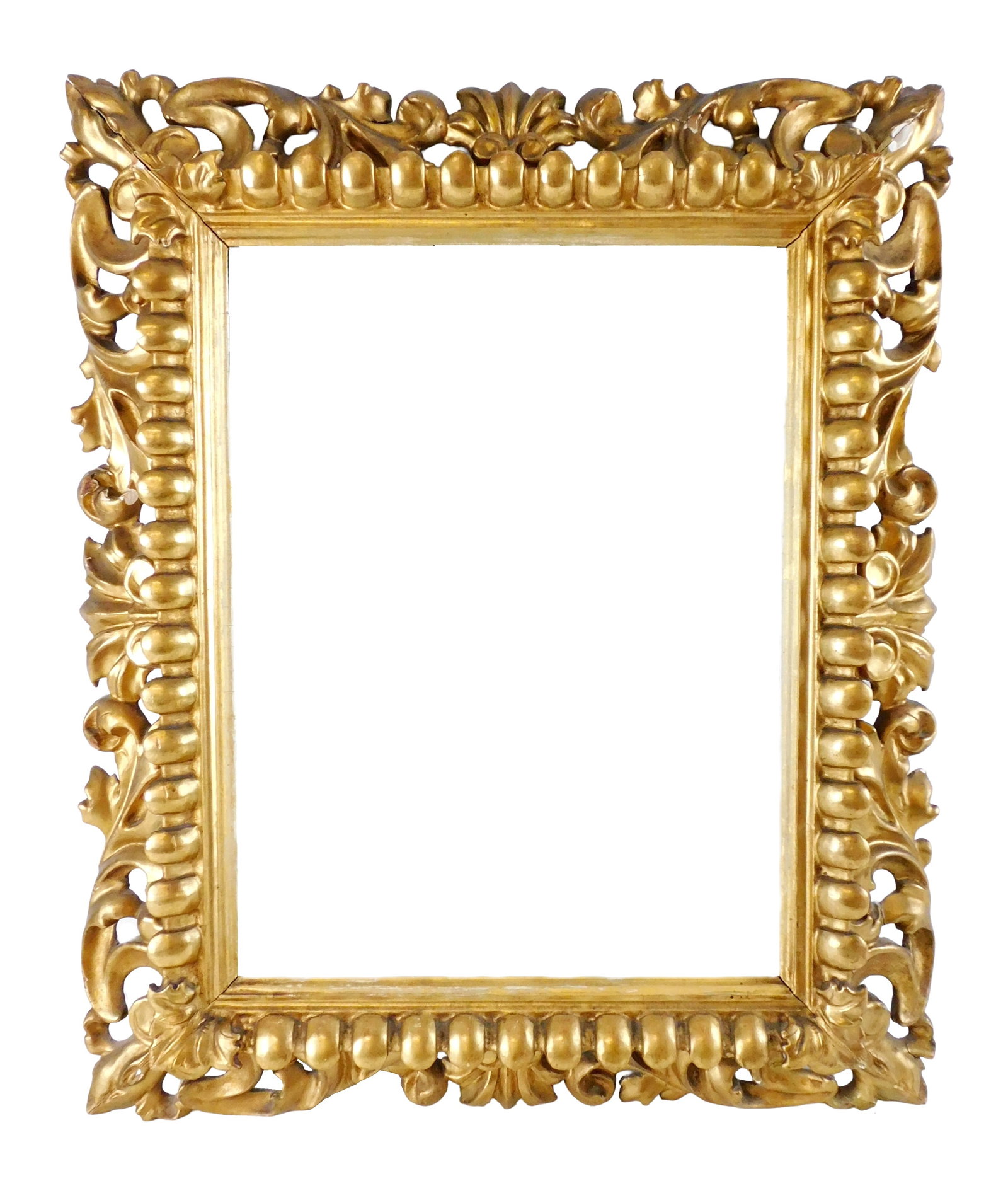 Carved giltwood wall mirror, 19th C. or earlier, reticulated frame with scrolling foliate motif, (1 of 5)