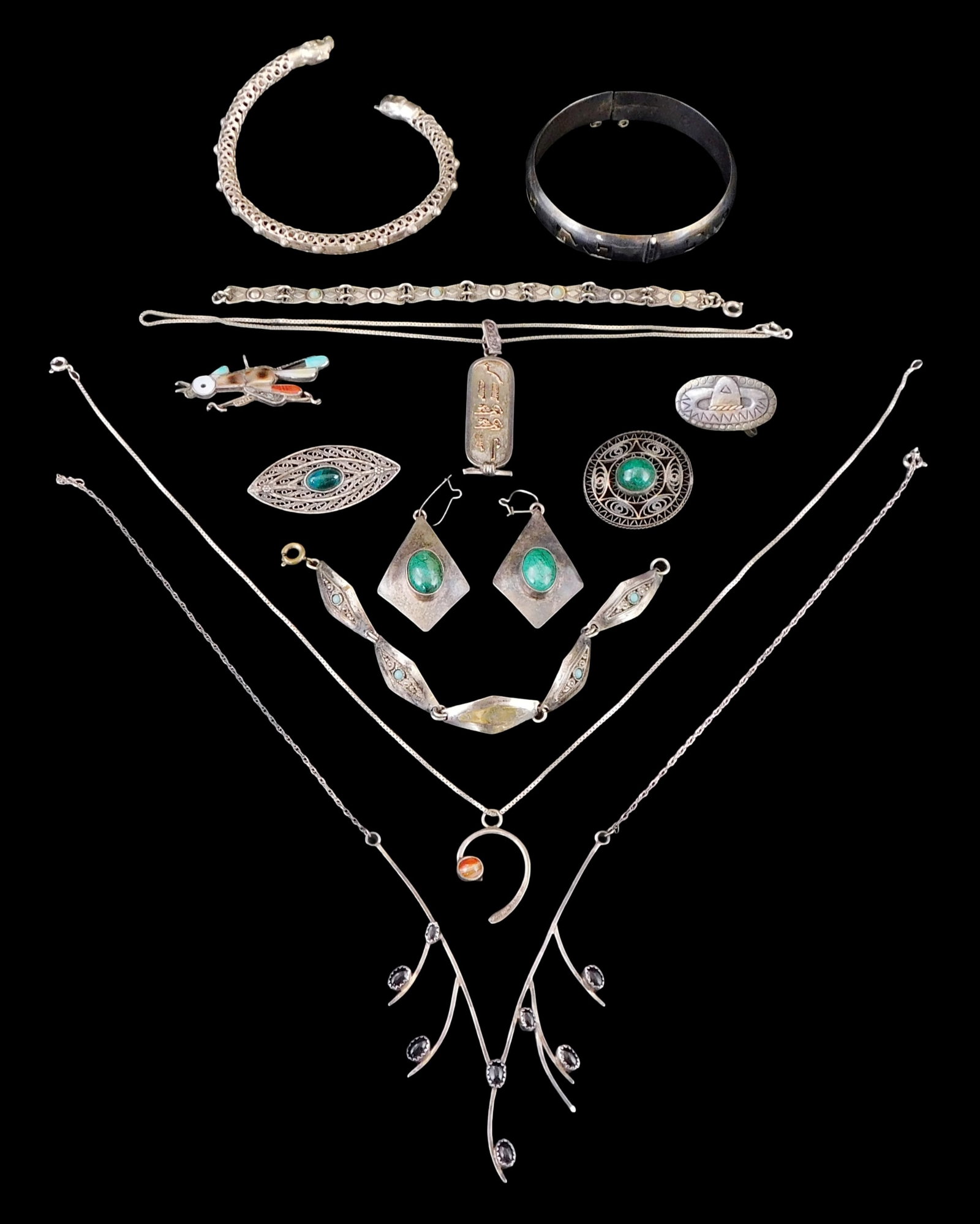 SILVER JEWELRY: Thirteen pieces of silver jewelry, all stamped "sterling" or tested silver, many: SILVER JEWELRY: Thirteen pieces of silver jewelry, all stamped "sterling" or tested silver, many inset with hardstones resembling onyx, malachite, turquoise, agate, mother of pearl, etc., many tribal 