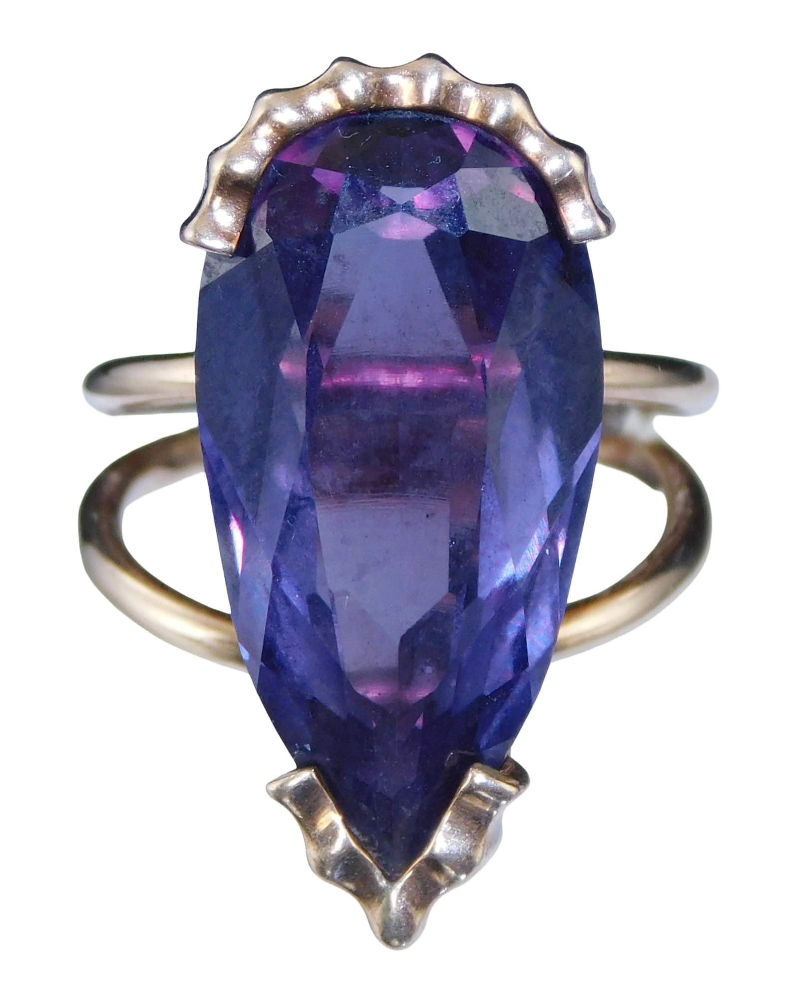 JEWELRY: 14K and synthetic sapphire ring, size 6, setting stamped and tested 14K gold, double shank: JEWELRY: 14K and synthetic sapphire ring, size 6, setting stamped and tested 14K gold, double shank with split shoulders, set with one pear shape bluish-purple synthetic sapphire [stone 24.6mm x 12.0m