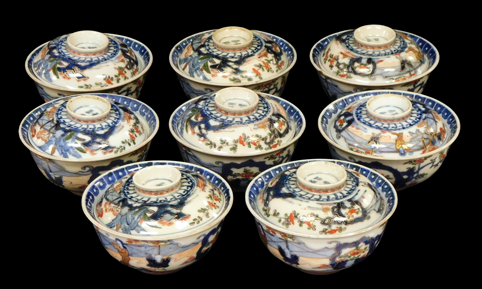 ASIAN: Eight Japanese Imari bowls with lids, 19th/ 20th C., decorated with figures in a landscape in (1 of 3)