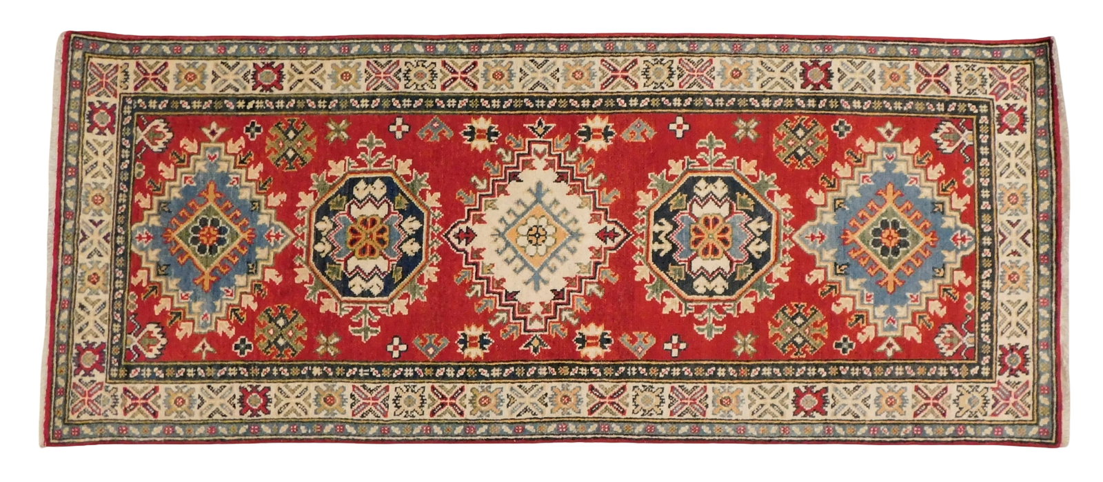 RUG: Uzbek Kazak runner, 2' 8" x 6' 6", wool on cotton, cream border, red ground, wear consistent: RUG: Uzbek Kazak runner, 2' 8" x 6' 6", wool on cotton, cream border, red ground, wear consistent with age and use, made in the last ten years.