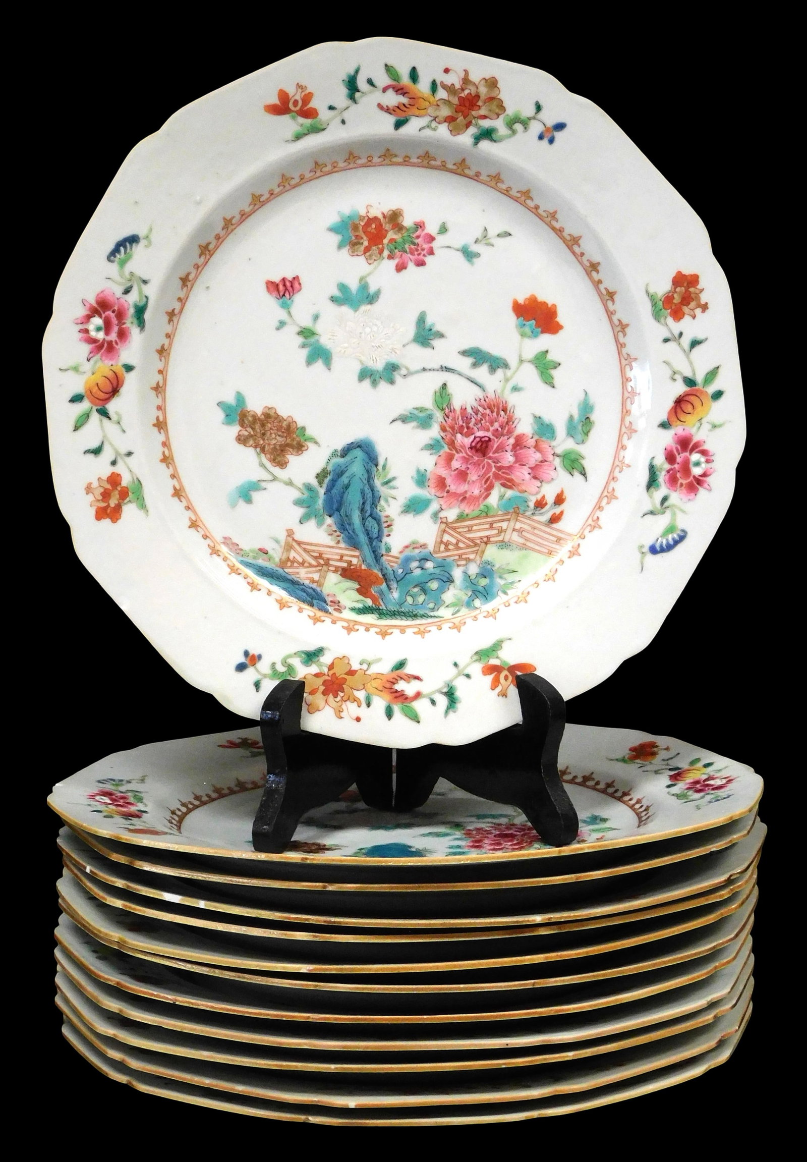 ASIAN: Set of twelve Chinese Export porcelain plates, 18th C., with shaped rims, floral decoration: ASIAN: Set of twelve Chinese Export porcelain plates, 18th C., with shaped rims, floral decoration in famille rose palette, some wear to enamels, a few chips to rim, etc., sold as is, 8 3/4" diam.