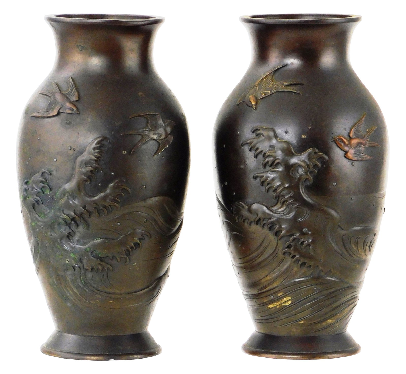 ASIAN: Pair of Japanese bronze vases with seabird and wave decoration in relief, likely Meiji: ASIAN: Pair of Japanese bronze vases with seabird and wave decoration in relief, likely Meiji Period, baluster form on foot, no markings observed, wear consistent with age and use, one with undulation