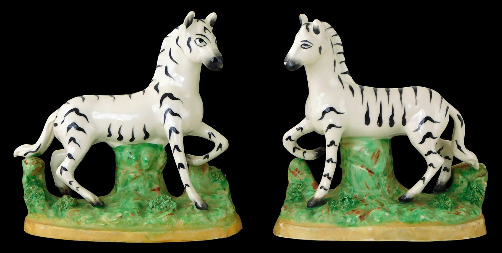 Pair of Staffordshire zebra figures, 19th C., England, polychromatic depictions of zebras standing (1 of 3)