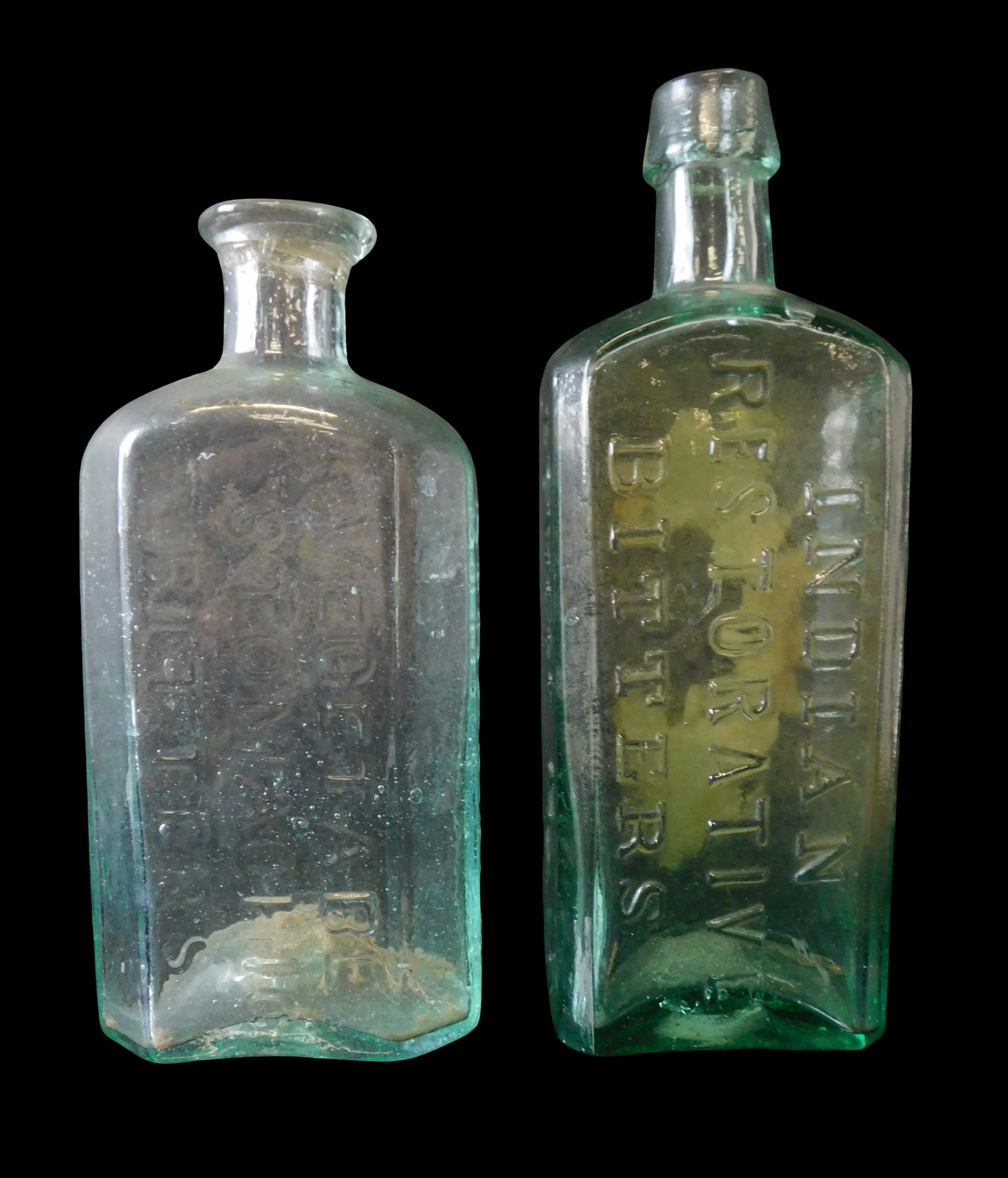GLASS: Two Massachusetts bitter's bottles, mid 19th C., both aqua glass, first "Dr. Ball's / (1 of 7)
