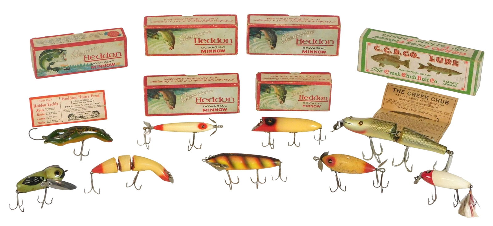 FISHING: Heddon Dowagiac and Creek Chub antique lures and boxes, eleven pieces, 1910's-1950's, most (1 of 4)
