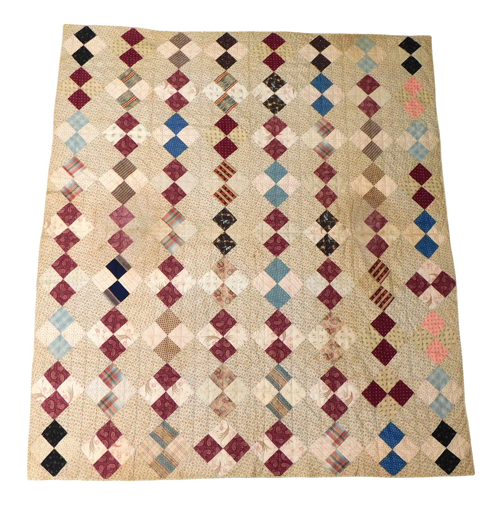 TEXTILE: Hand stitched American quilt/coverlet, 87" x 75 1/2", 19th C. or later, cotton, geometric: TEXTILE: Hand stitched American quilt/coverlet, 87" x 75 1/2", 19th C. or later, cotton, geometric design with calico blocks interspersed with varied polychrome pairs, edged in calico, wear consistent