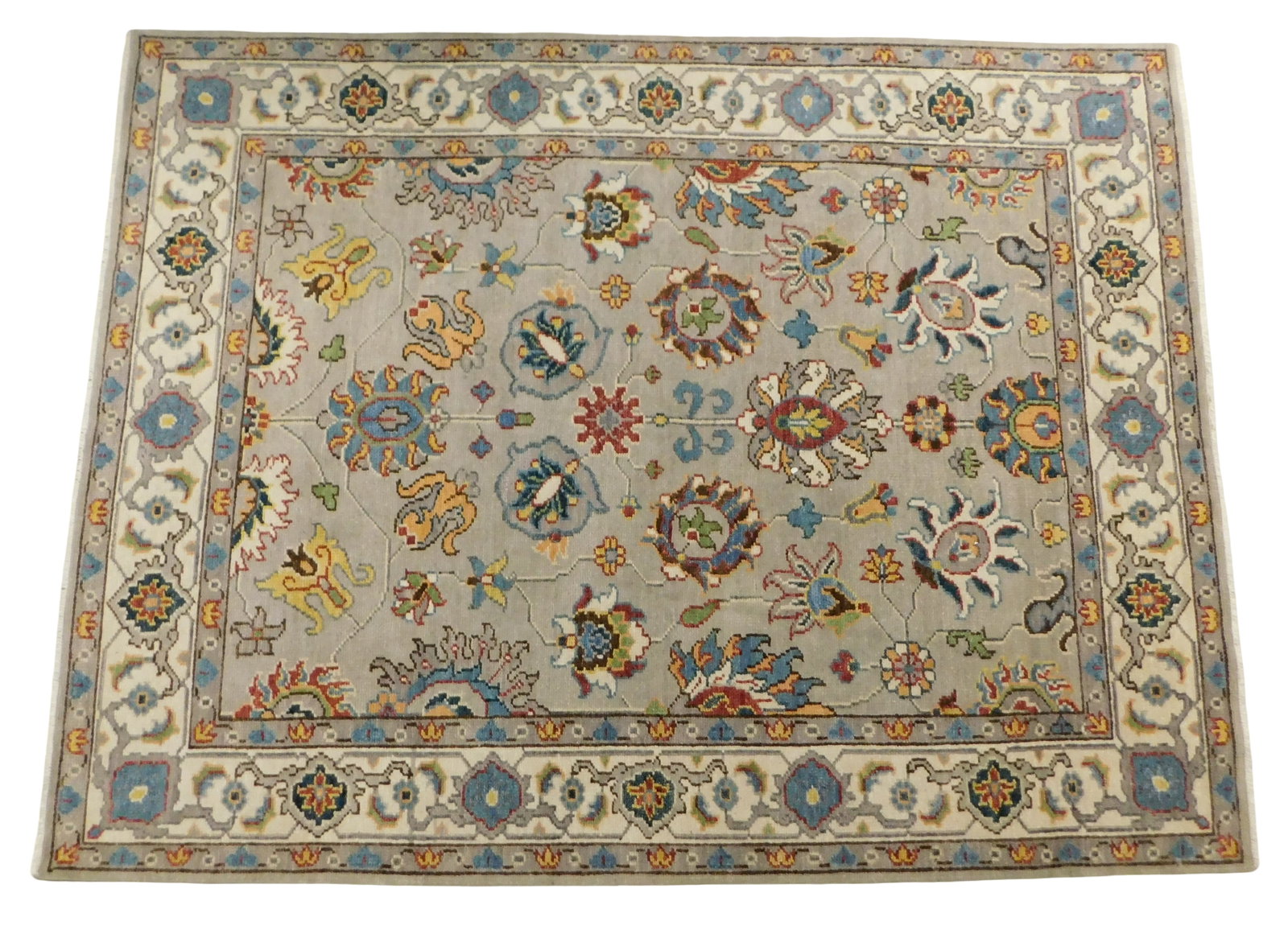 RUG: Agra Sultanabad carpet, 8' x 10' 1", wool on cotton, light gray ground, cream and brown: RUG: Agra Sultanabad carpet, 8' x 10' 1", wool on cotton, light gray ground, cream and brown borders, blue, red and yellow accents, floral motifs throughout, wear consistent with age and use, made in 
