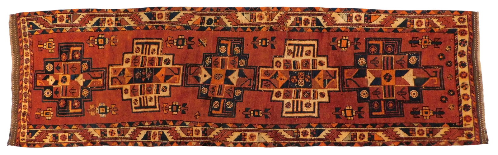 RUG: Kurd rug, 4' x 12', wool on wool, red ground, navy accents, wear consistent with age and use. (1 of 4)