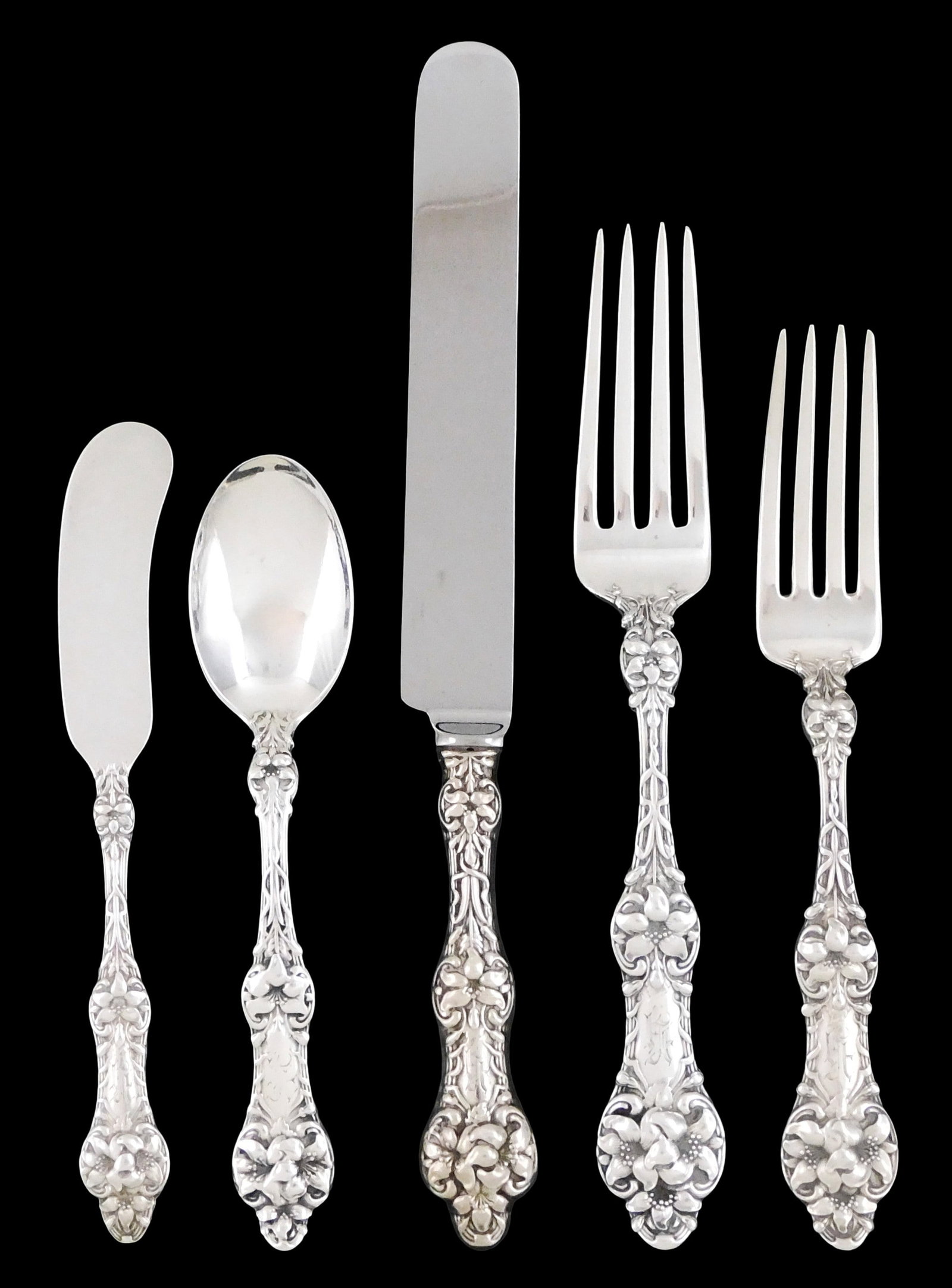 STERLING: "Orange Blossom" sterling silver flatware by Alvin Manf. Co., Providence, RI (active 1887: STERLING: "Orange Blossom" sterling silver flatware by Alvin Manf. Co., Providence, RI (active 1887 - present), thirty-six pieces, all ornately decorated with lilies and hallmarked on reverse, pieces 
