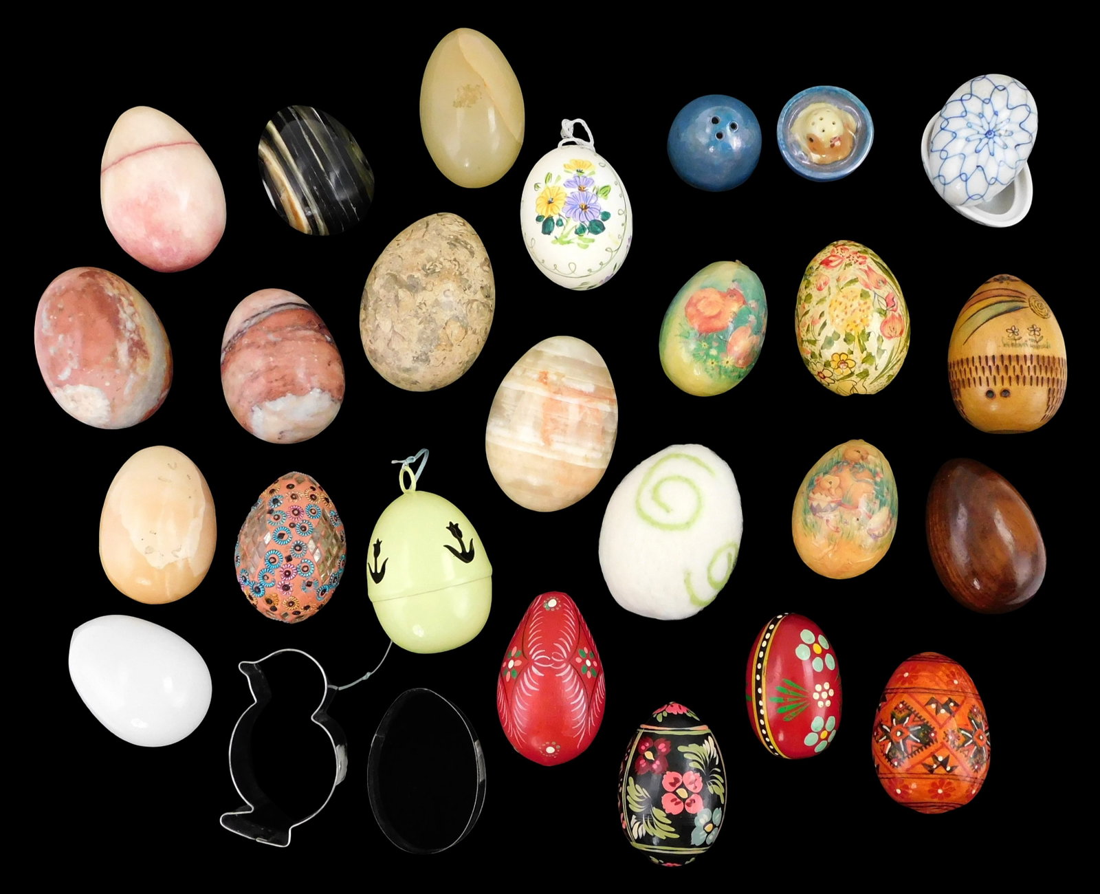Collection of decorative eggs and related accessories, twenty-six pieces, 20th-21st C., grouping (1 of 3)