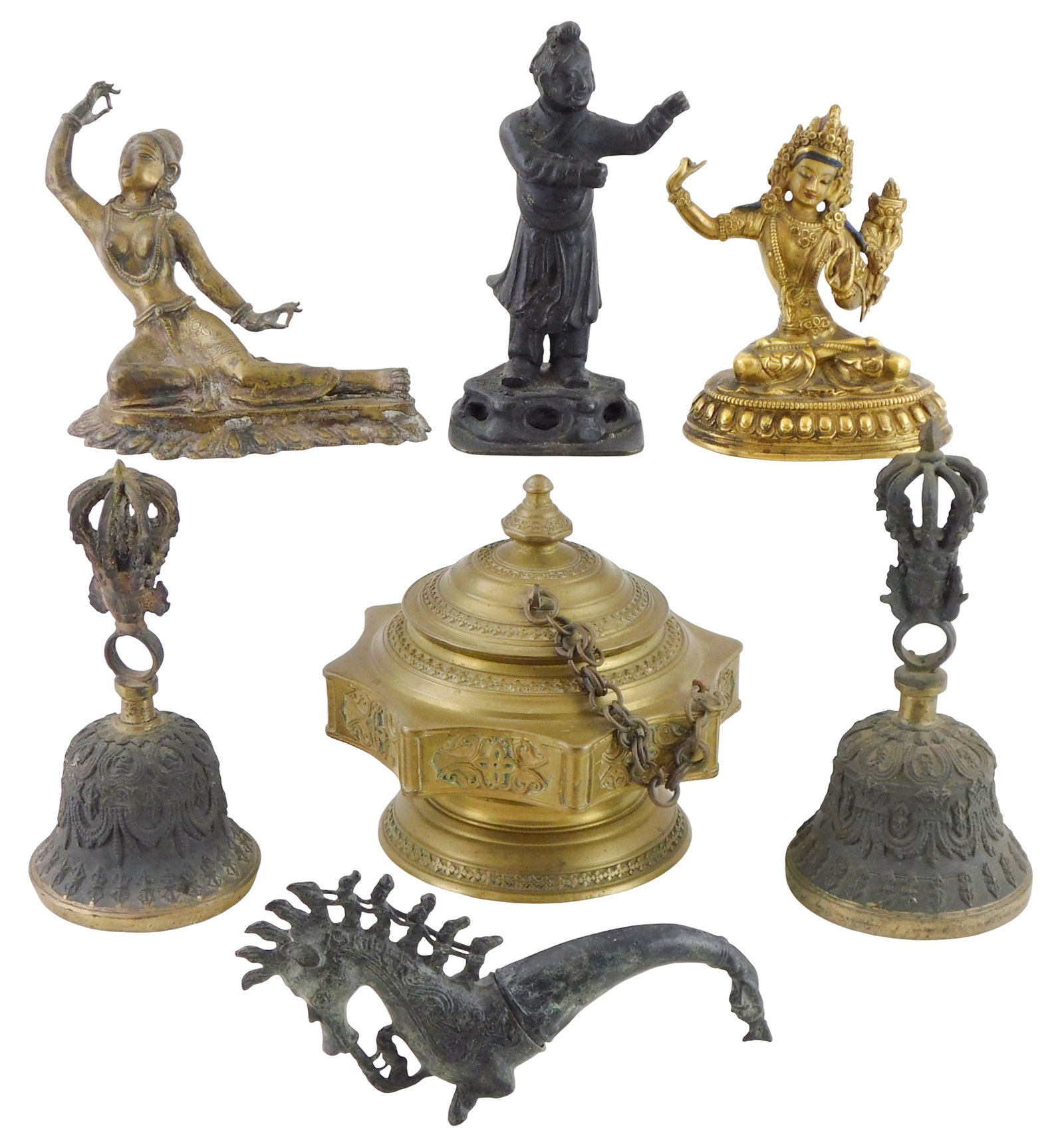 ASIAN: Seven pieces of decorative metalware, 19th-20th C., including: Sino-Tibetan gilt bronze: ASIAN: Seven pieces of decorative metalware, 19th-20th C., including: Sino-Tibetan gilt bronze figure of Tara; two Tibetan bells; a standing Chinese figure; an Indian reclining figure, possibly Sarasw