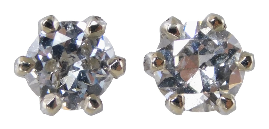 JEWELRY: Pair of 14K and diamond stud earrings, stamped '585' and tested white gold, four-prong: JEWELRY: Pair of 14K and diamond stud earrings, stamped '585' and tested white gold, four-prong crowns and screw post backs and ear nuts, each set with one round brilliant natural diamond, approximate