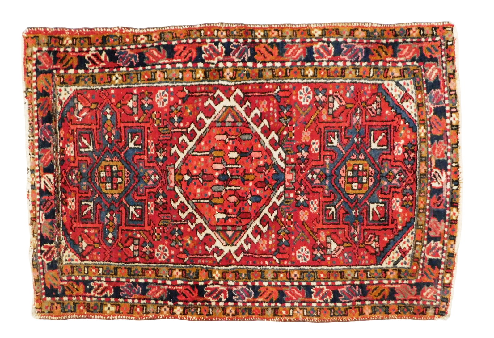 RUG: Semi-antique Persian Karaja, 2' 10" x 4' 2", wool on cotton, red ground, navy and brown: RUG: Semi-antique Persian Karaja, 2' 10" x 4' 2", wool on cotton, red ground, navy and brown accents, three medallions, center with latch hook, wear consistent with age and use including edge wear, en
