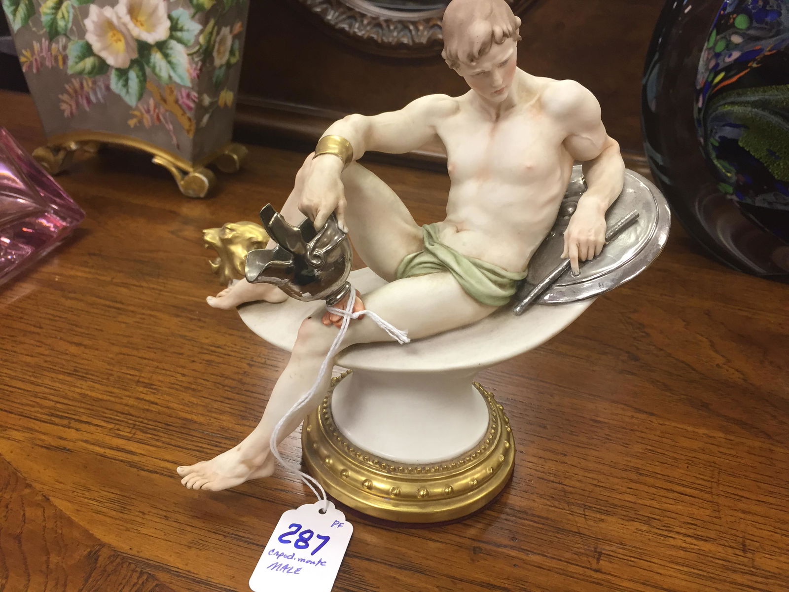 Capodimonte Male Figure Lounging: Capodimonte Male Figure Lounging Dimensions: 7.5" x 7.5" x 3.5"